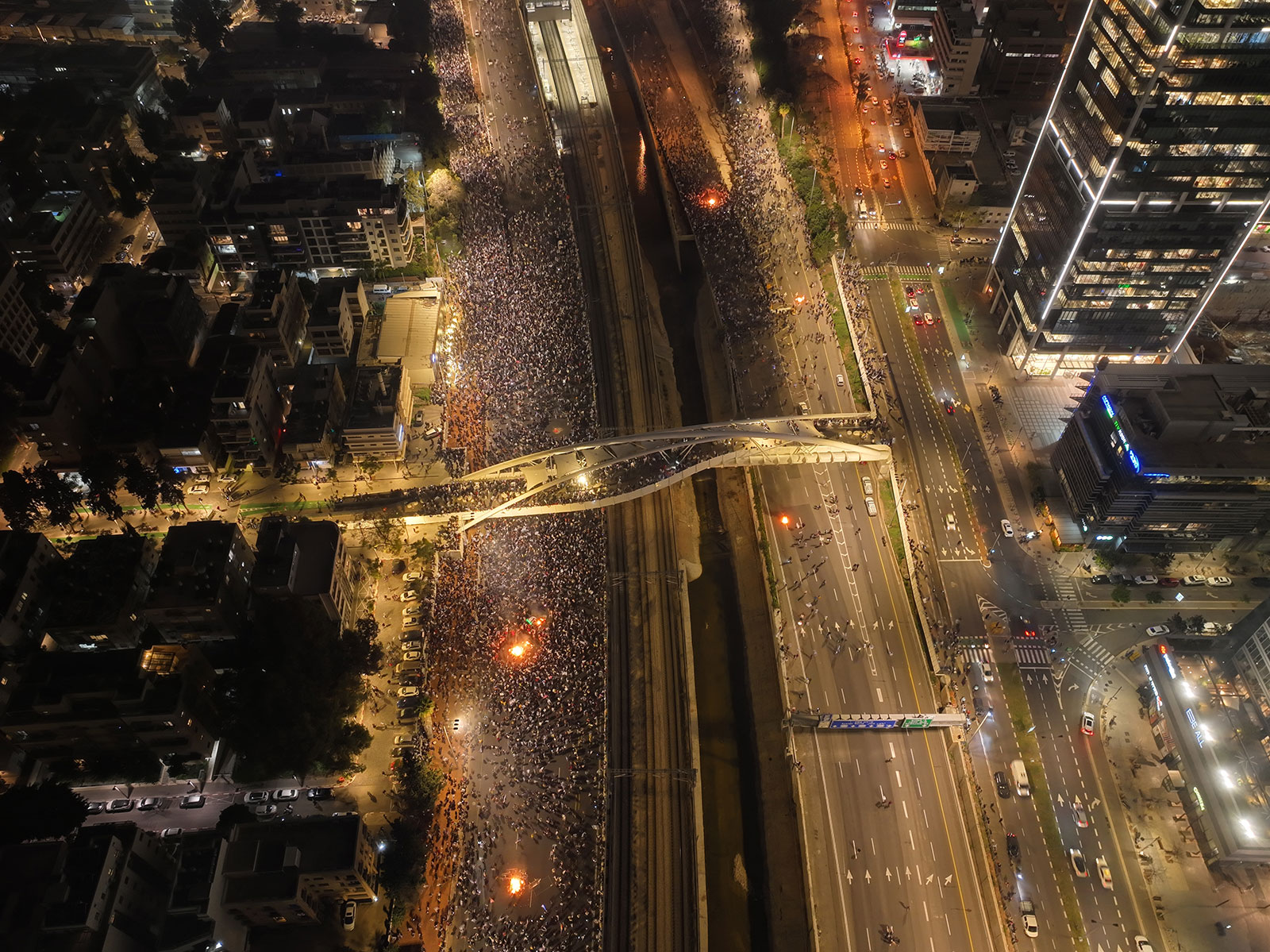 An aerial view shows thousands of Israelis protesting as they block Ayalon highway in Tel Aviv, Israel, on March 27. 