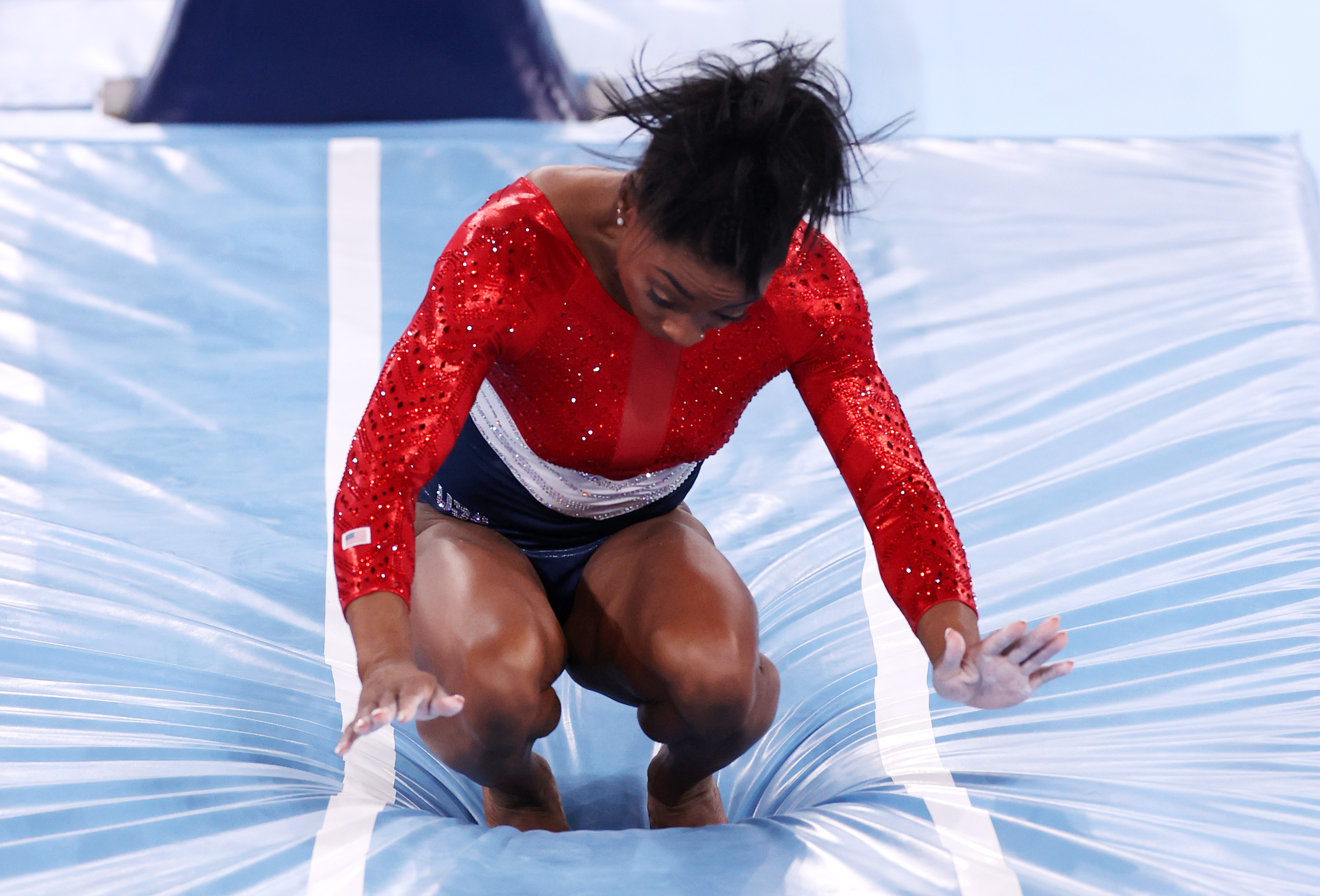 Simone Biles stumbles upon landing after competing in vault on July 27.