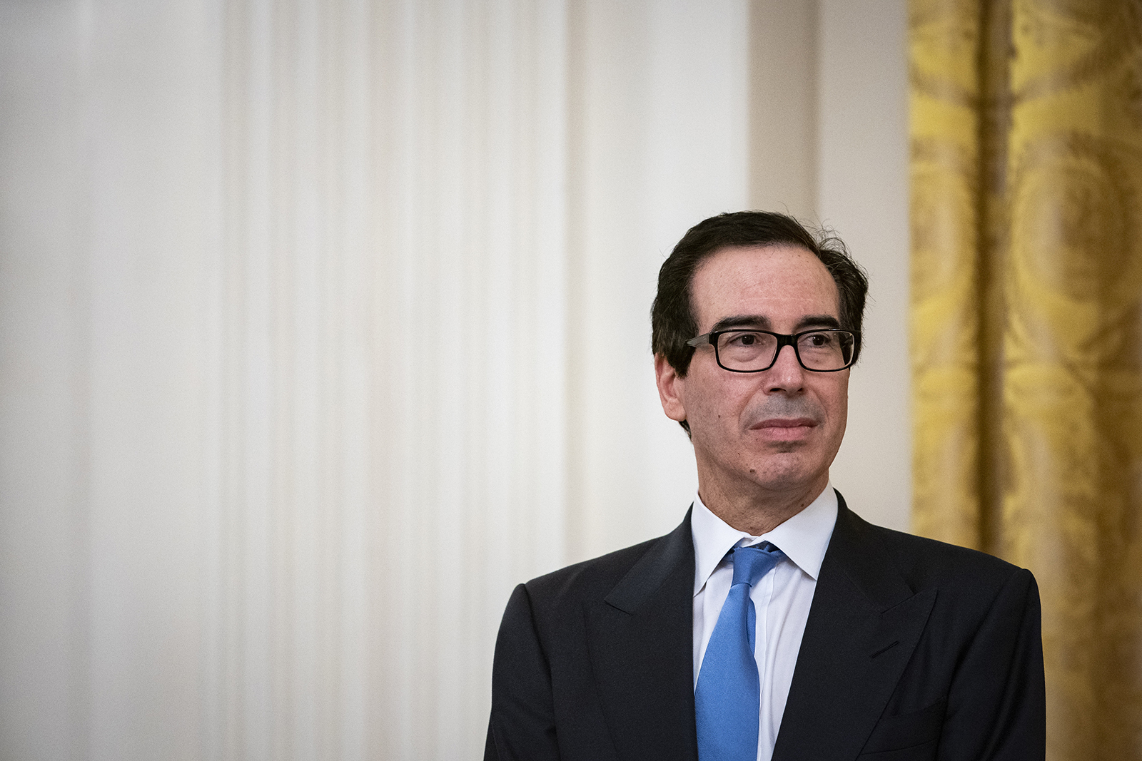 Steven Mnuchin, U.S. Treasury secretary, listens during a Paycheck Protection Program (PPP) at the White House in Washington, DC, on Tuesday, April 28.