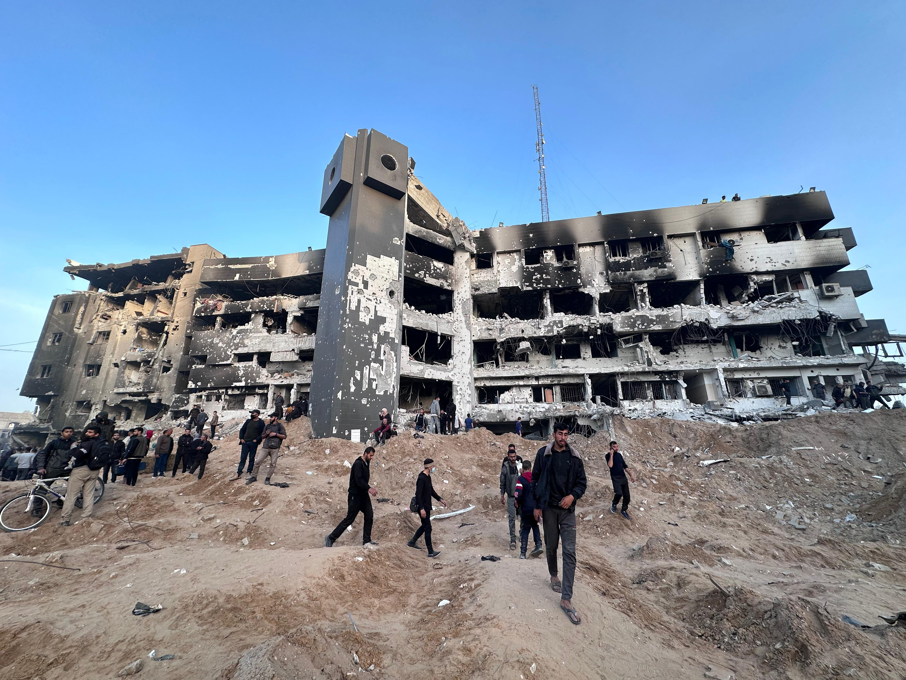 People inspect the damage at Al-Shifa hospital in Gaza on April 1.