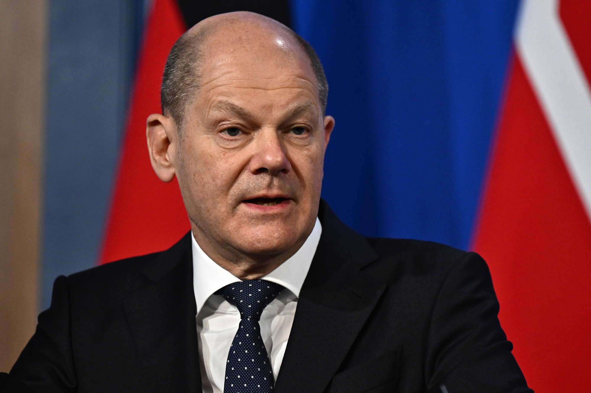 German Chancellor Olaf Scholz speaks during a press conference on April 8 in London, England. 