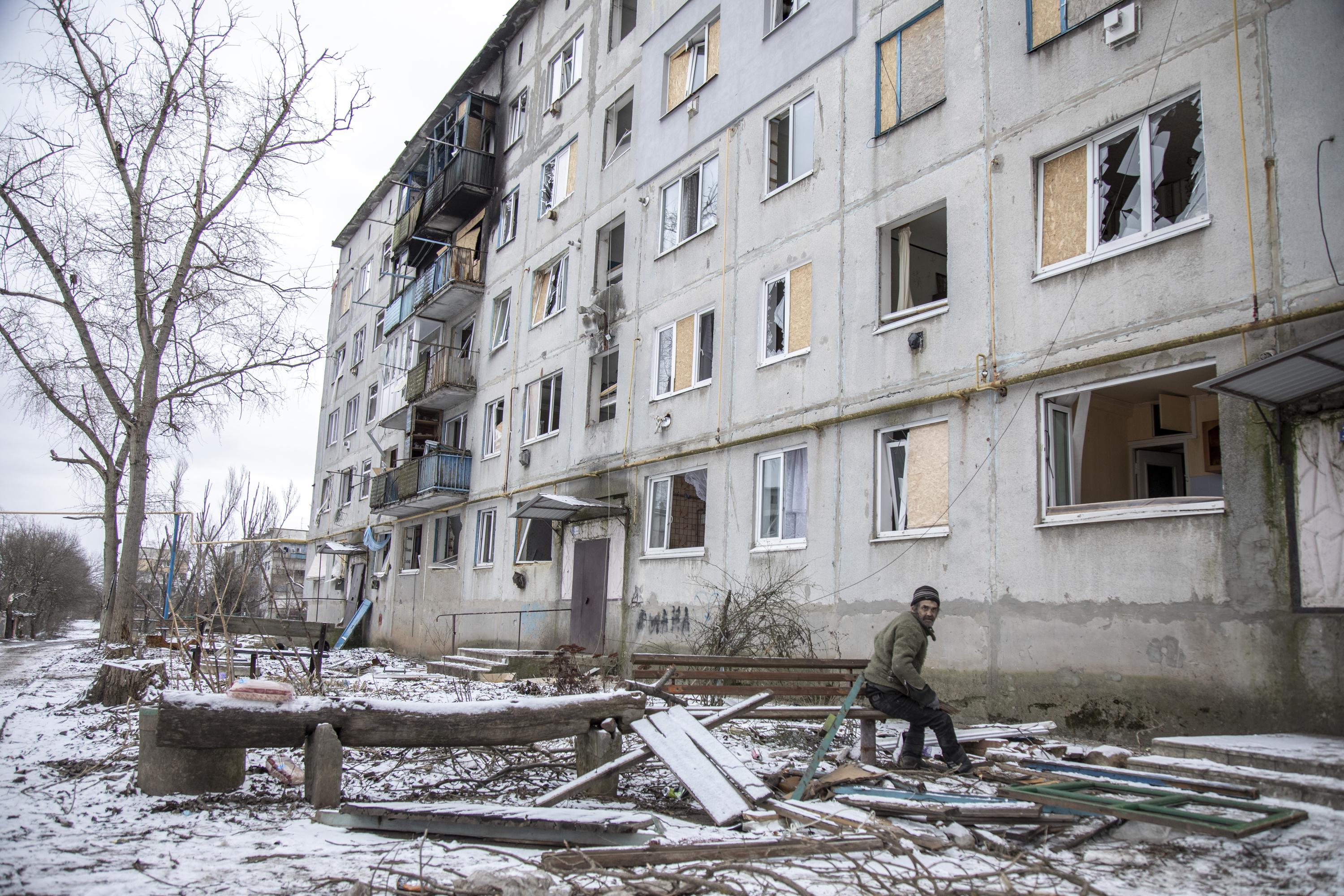 A local civilian chops wood for making fire in the downtown of Ocheretyne, a village near Avdiivka on February 19.