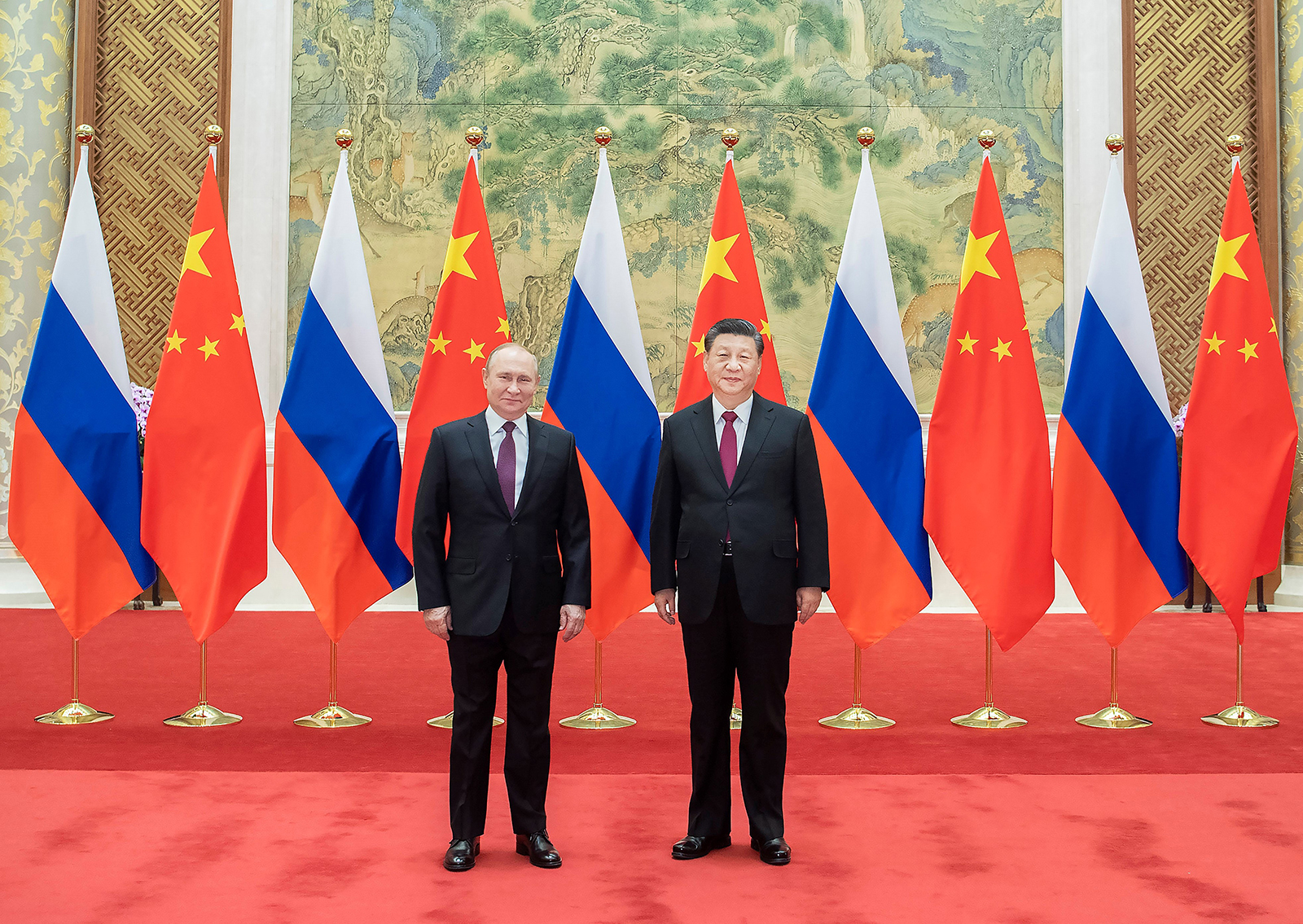 Xi Jinping and Vladimir Putin pose for pictures in Beijing on February 4, 2022. 