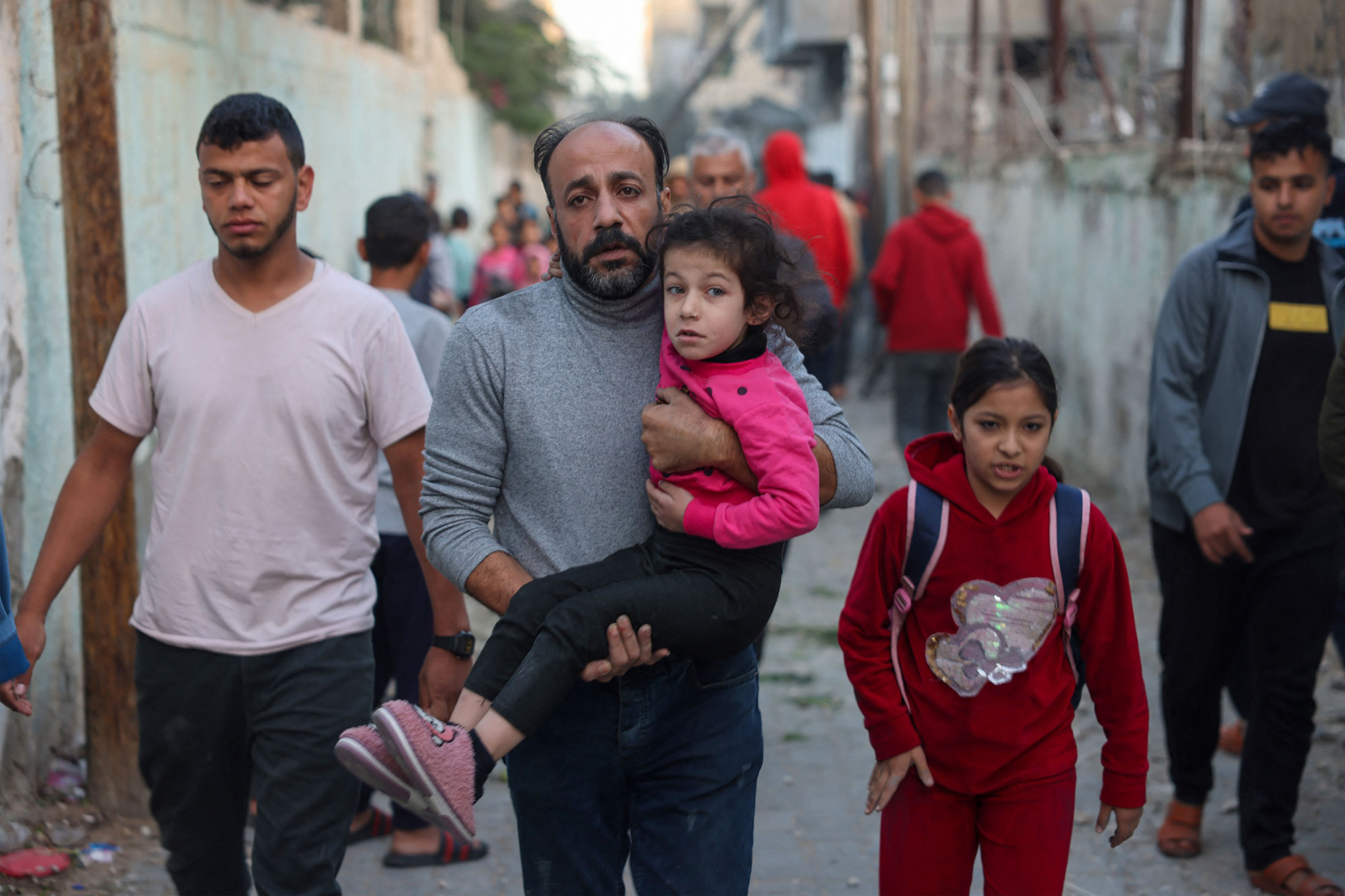 People flee following an Israeli strike in Rafah, Gaza, on November 23.