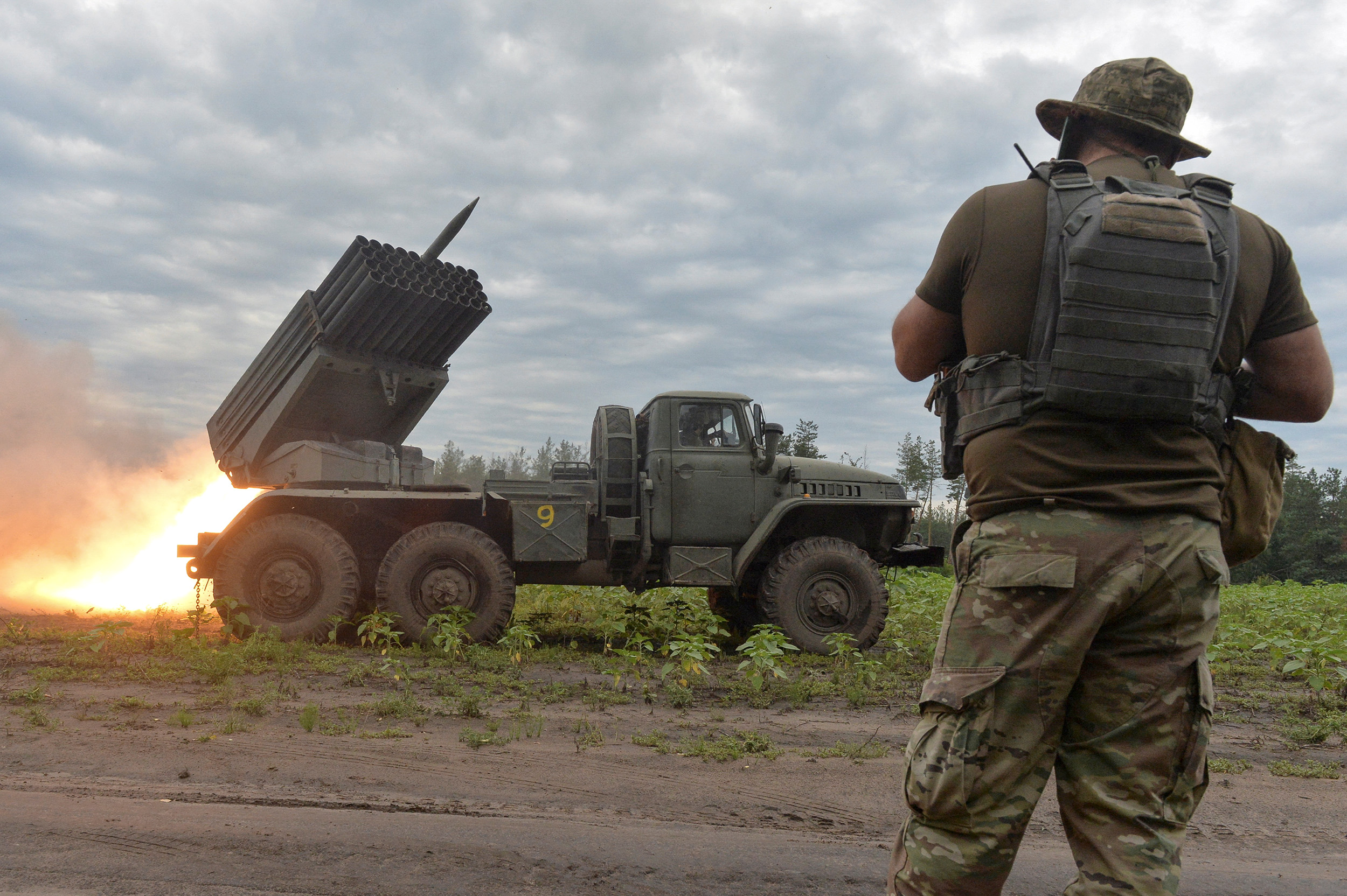 Ukrainian servicemen fire with a BM21 Grad multiple launch rocket system at the frontline in the Kharkiv region, Ukraine, on August 2.