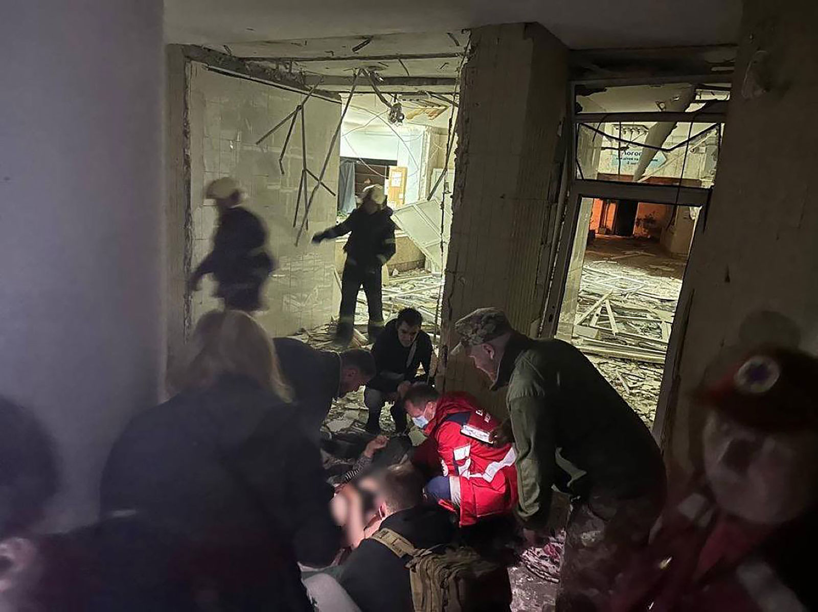 Emergency services responds after an early morning airstrike in Kyiv's Desnianskyi district. Portions of this image were obscured before they were provided to CNN.