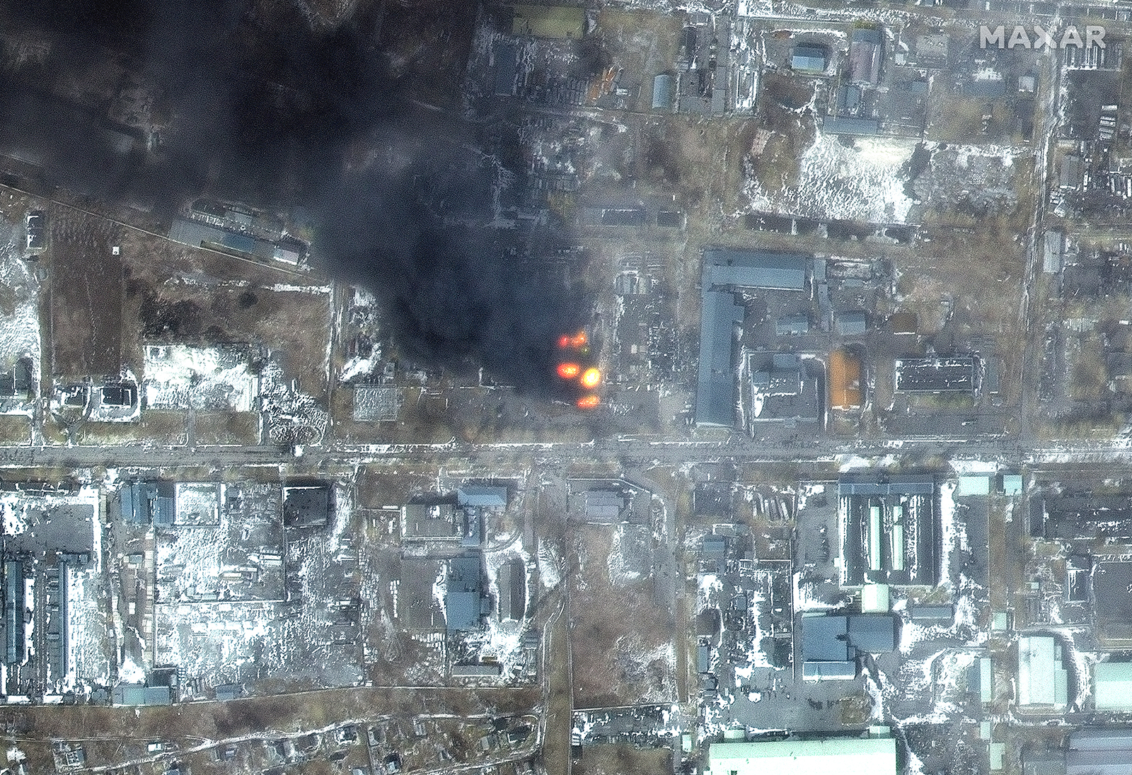 A large fire is seen raging in an industrial area in the Primorskyi neighborhood of western Mariupol on March 12.