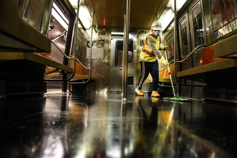 A cleaning crew member disinfects a New York City subway train on May 4.