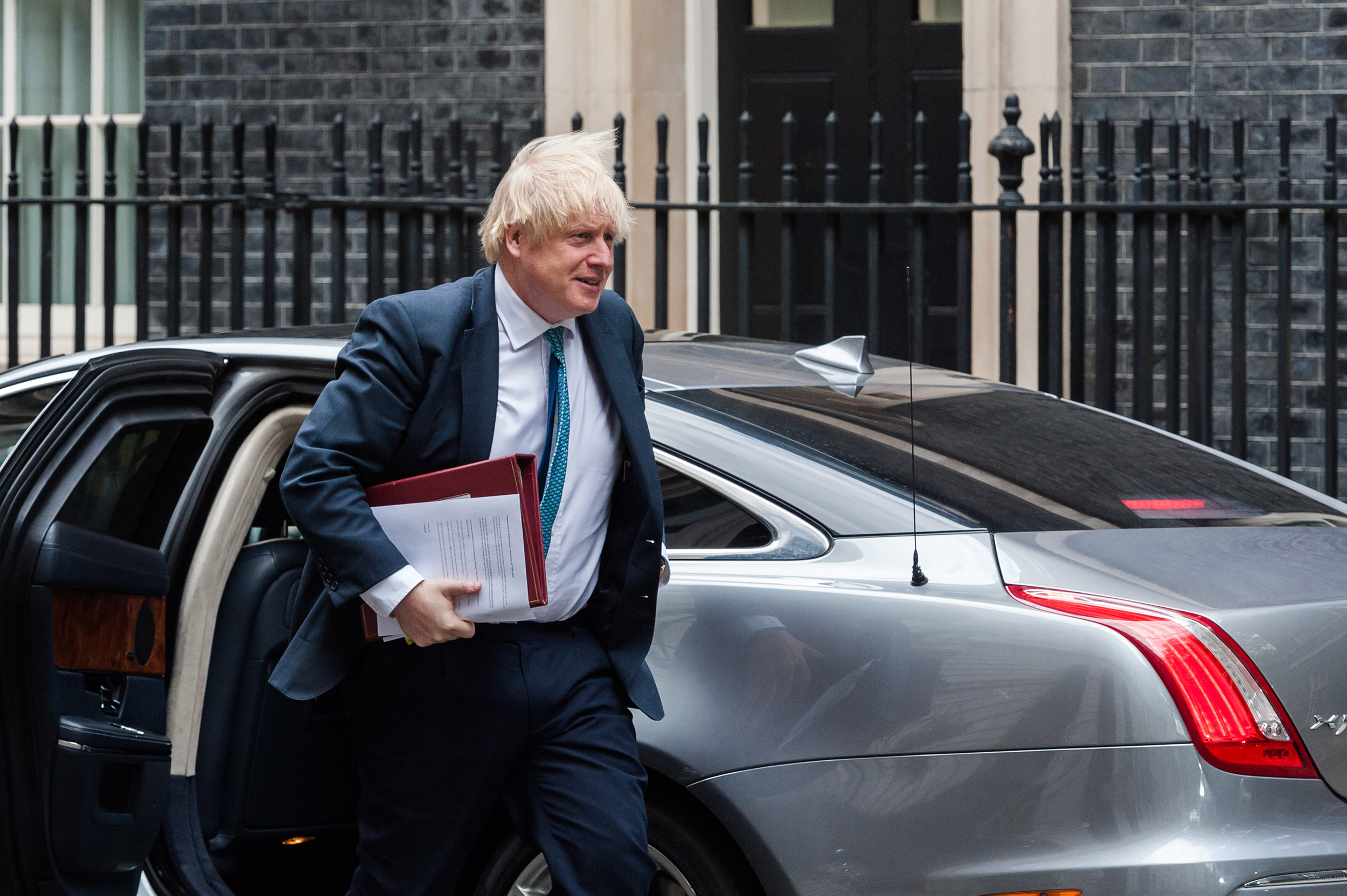 British Prime Minister Boris Johnson arrives on Downing Street after leaving the House of Commons in London, England, on Wednesday, May 13. 