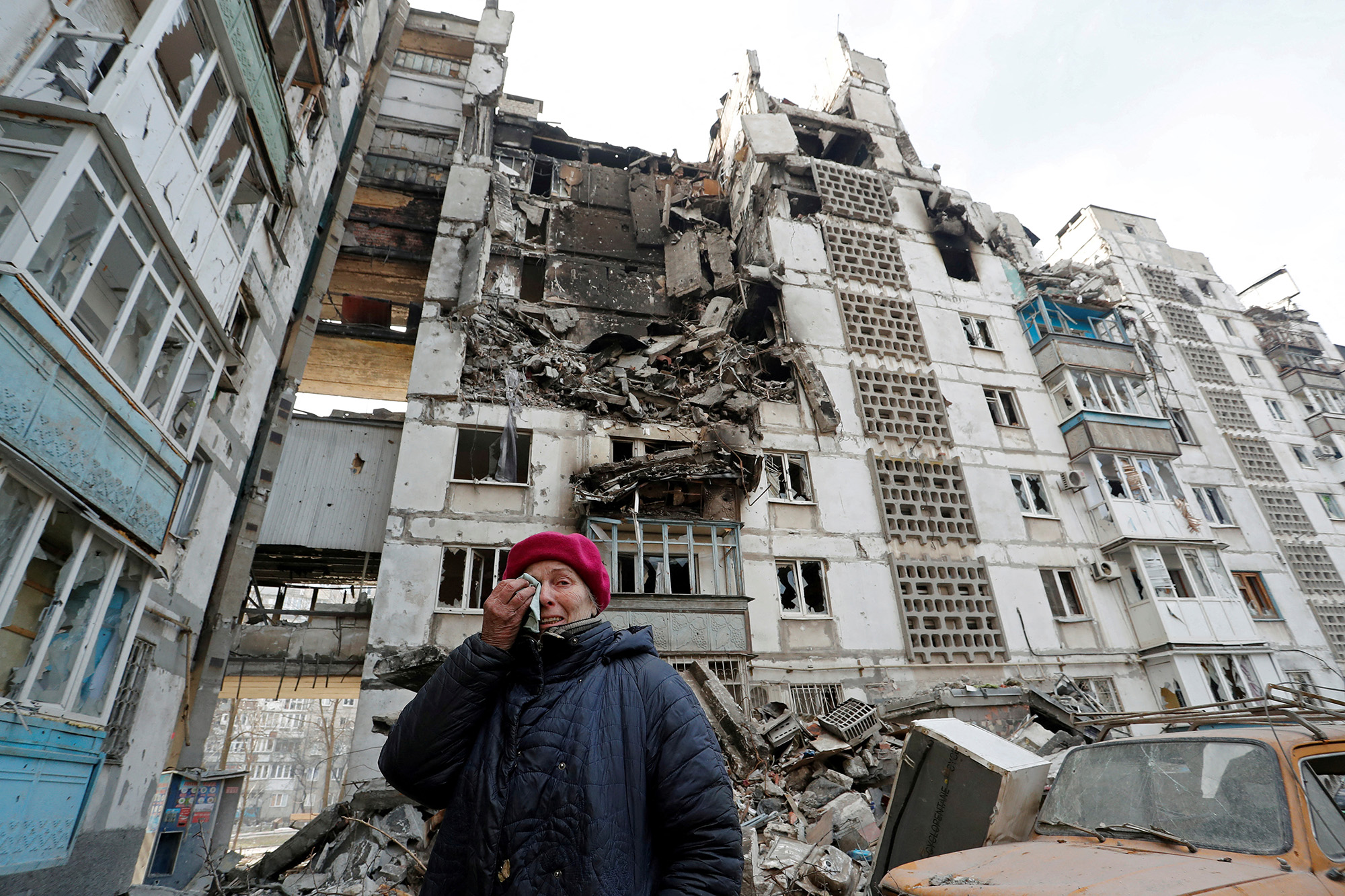 Local resident Valentina Demura, 70, next to her apartment building in the besieged southern port city of Mariupol, Ukraine, on March 27.