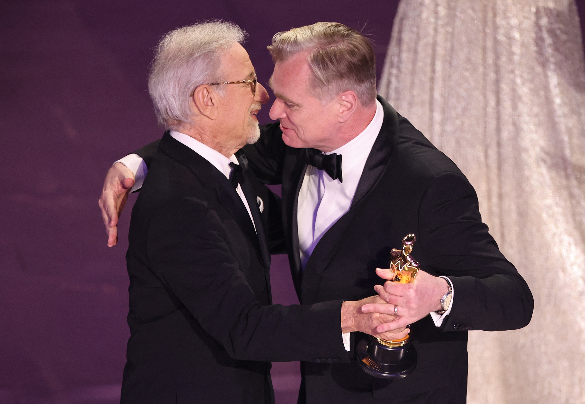 Steven Spielberg presents Christopher Nolan with the Oscar for best director. 