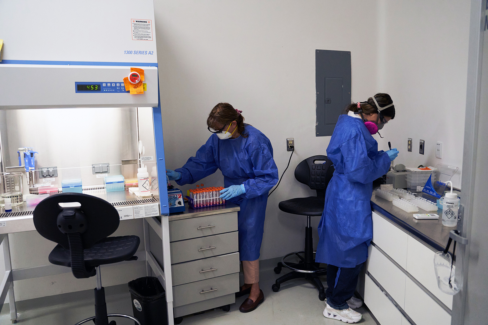 Pharmaceutical biochemists process Covd-19 tests at a laboratory at the Autonomous University of San Luis Potosi (UASLP) Research Center in Health Sciences and Biomedicine in San Luis Potosi, Mexico, on Friday, July 24.