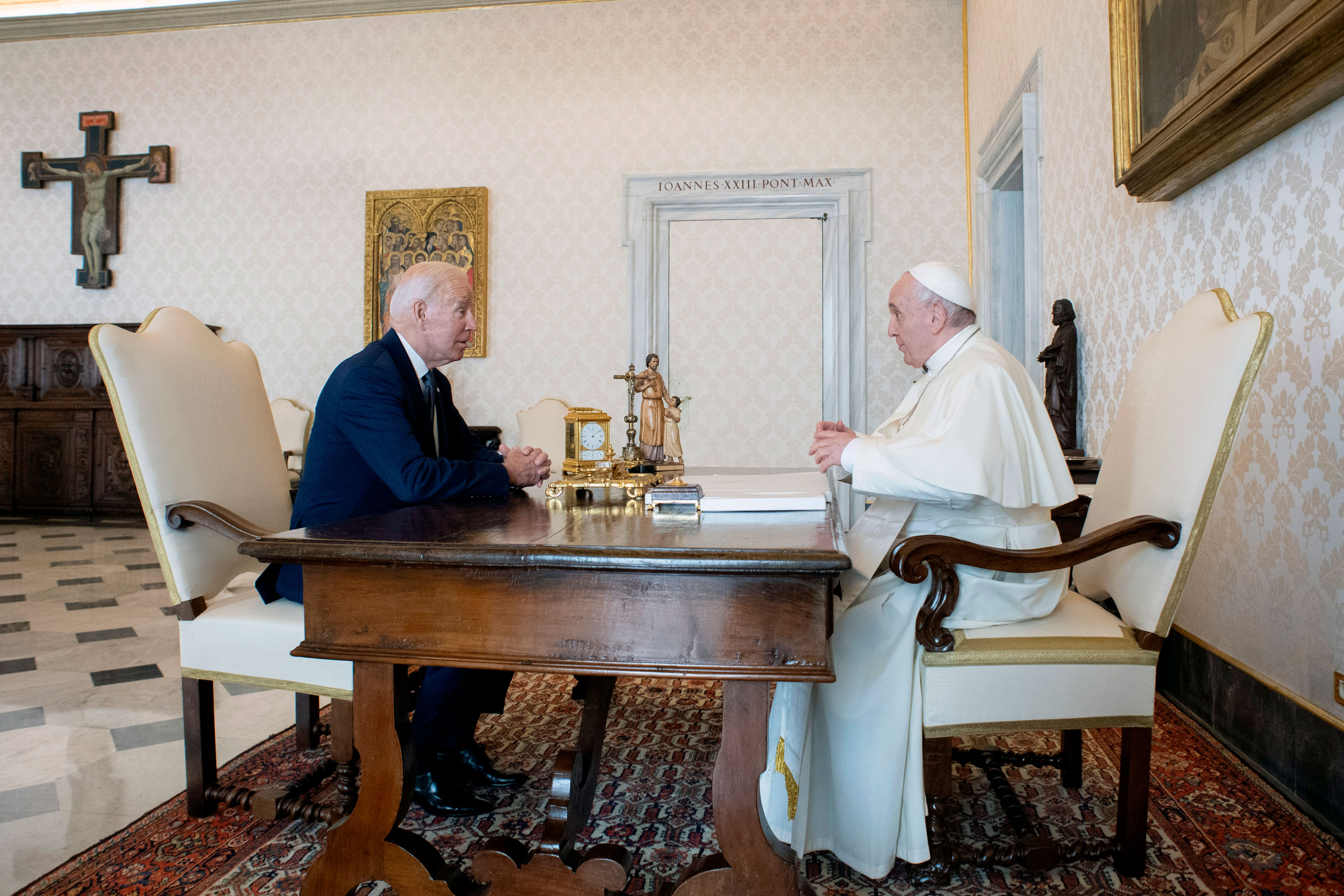 President Joe Biden speaks with Pope Francis as they meet at the Vatican on October 29.