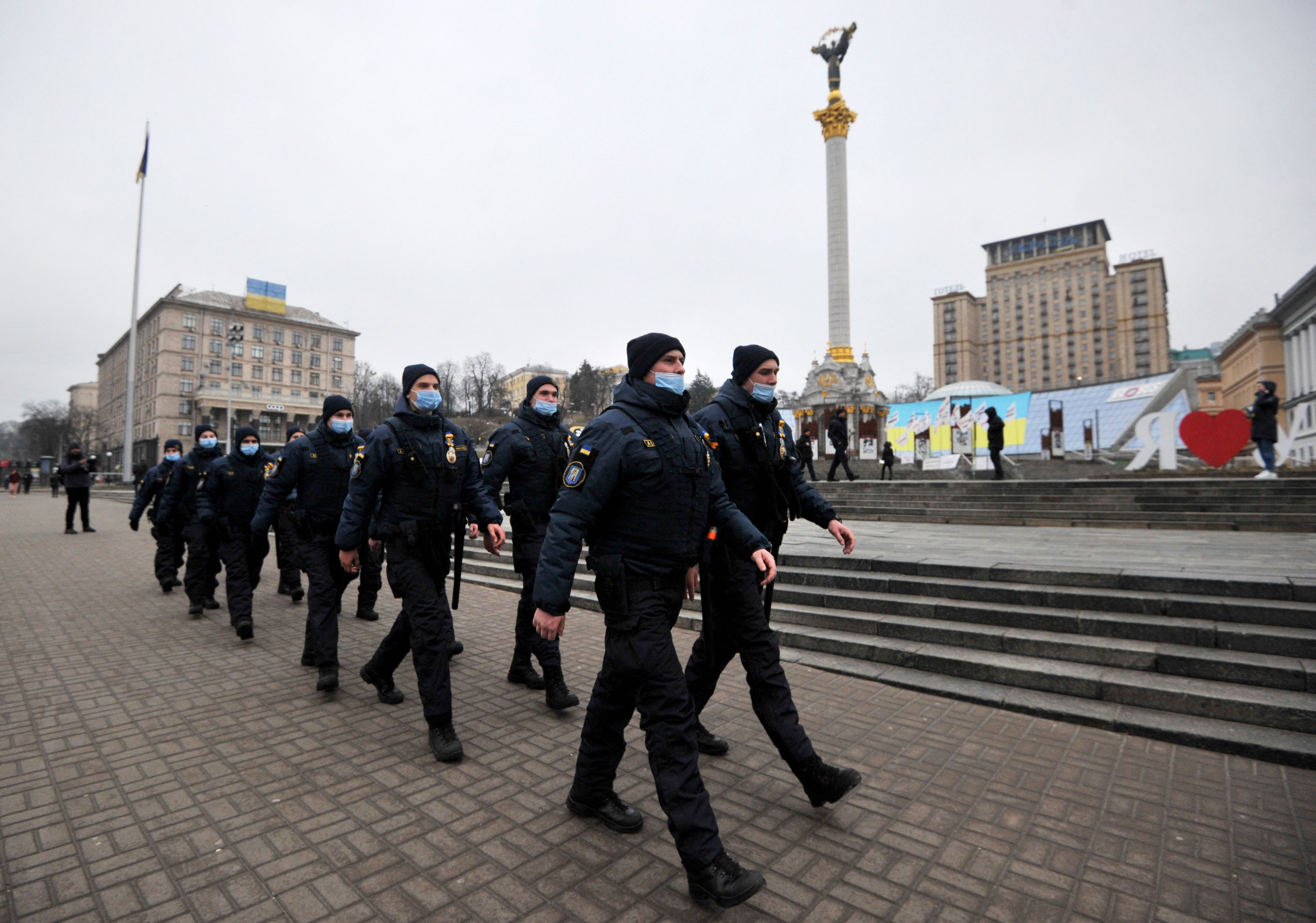 Ukrainian police officers march in Independence Square in central Kyiv on February 16. 