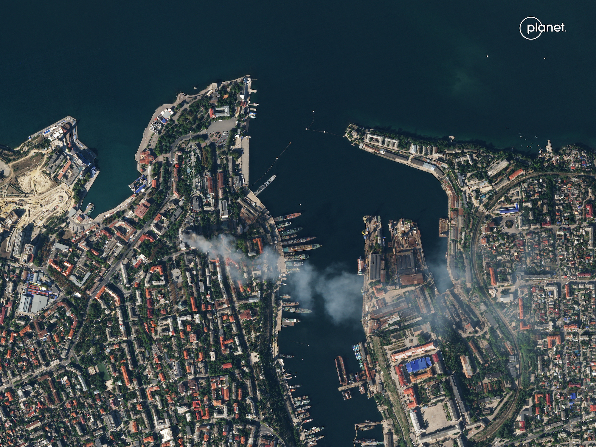 A satellite image shows smoke billowing from the Russian Black Sea Navy HQ after a missile strike in Sevastopol, Crimea, on Friday.