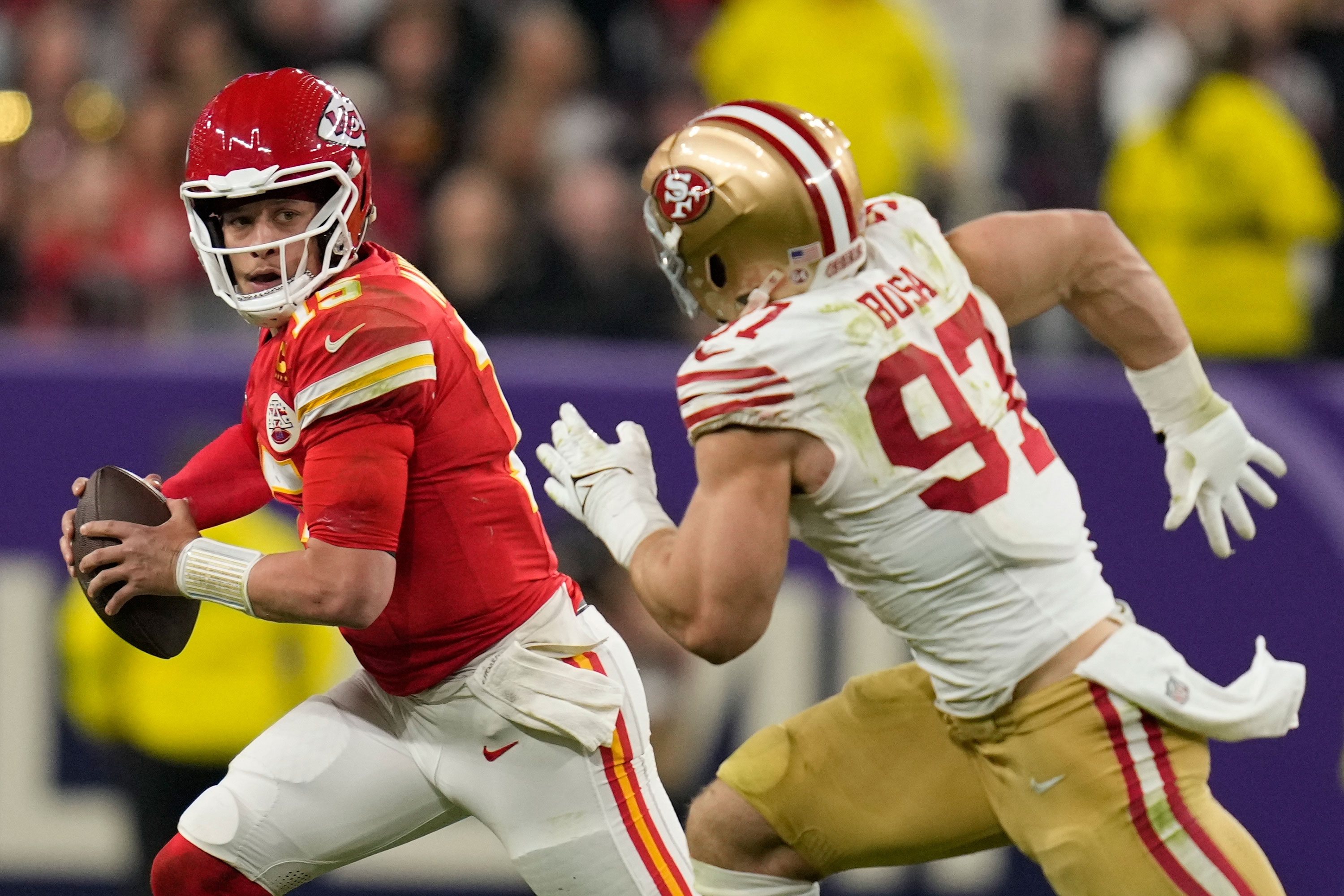 San Francisco 49ers defensive end Nick Bosa chases Kansas City Chiefs quarterback Patrick Mahomes during the second half of the Super Bowl.
