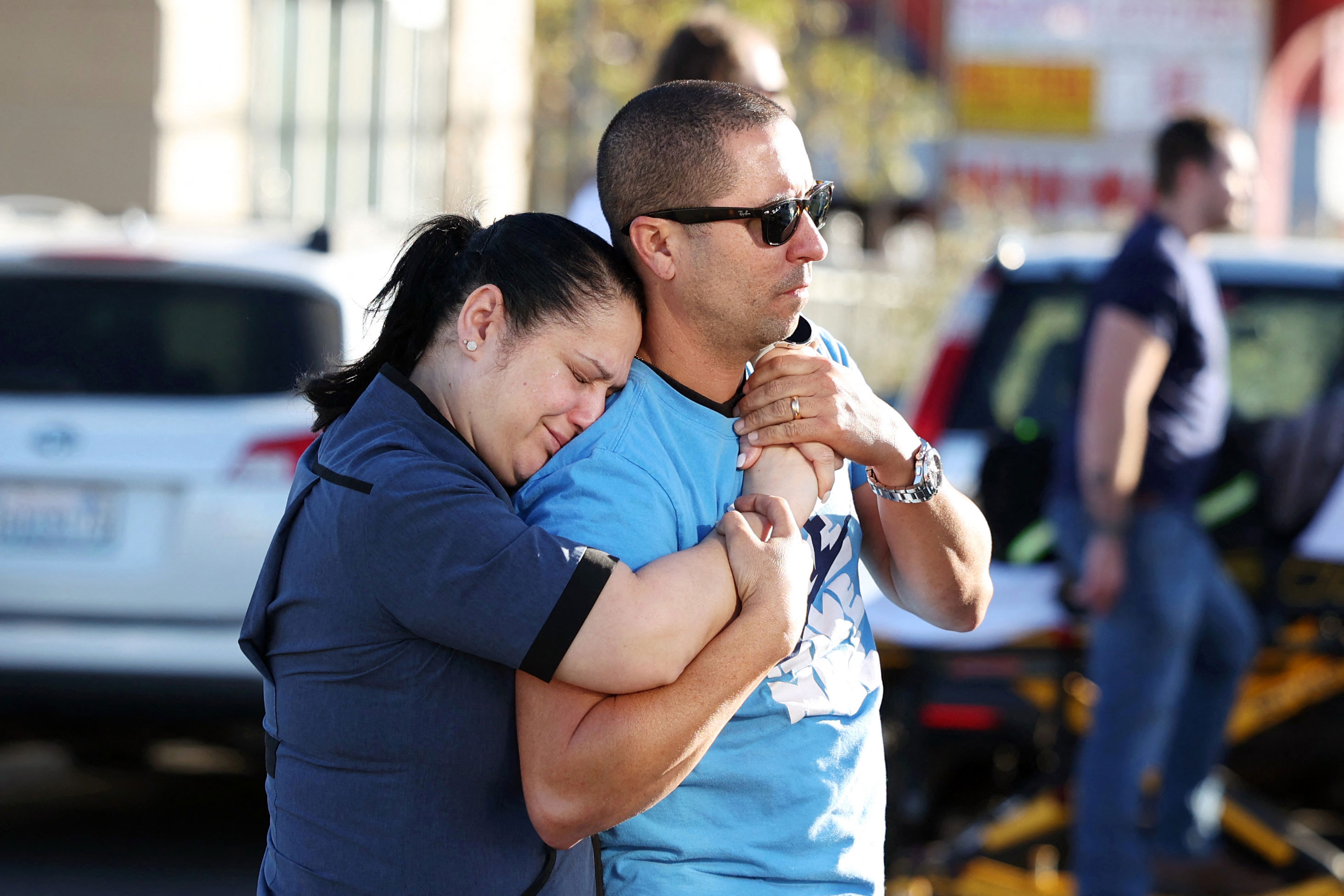 Parents Mabel Fontanilla and Raul Villalonga embrace after a shooting at the University of Nevada, Las Vegas, campus on Wednesday. 