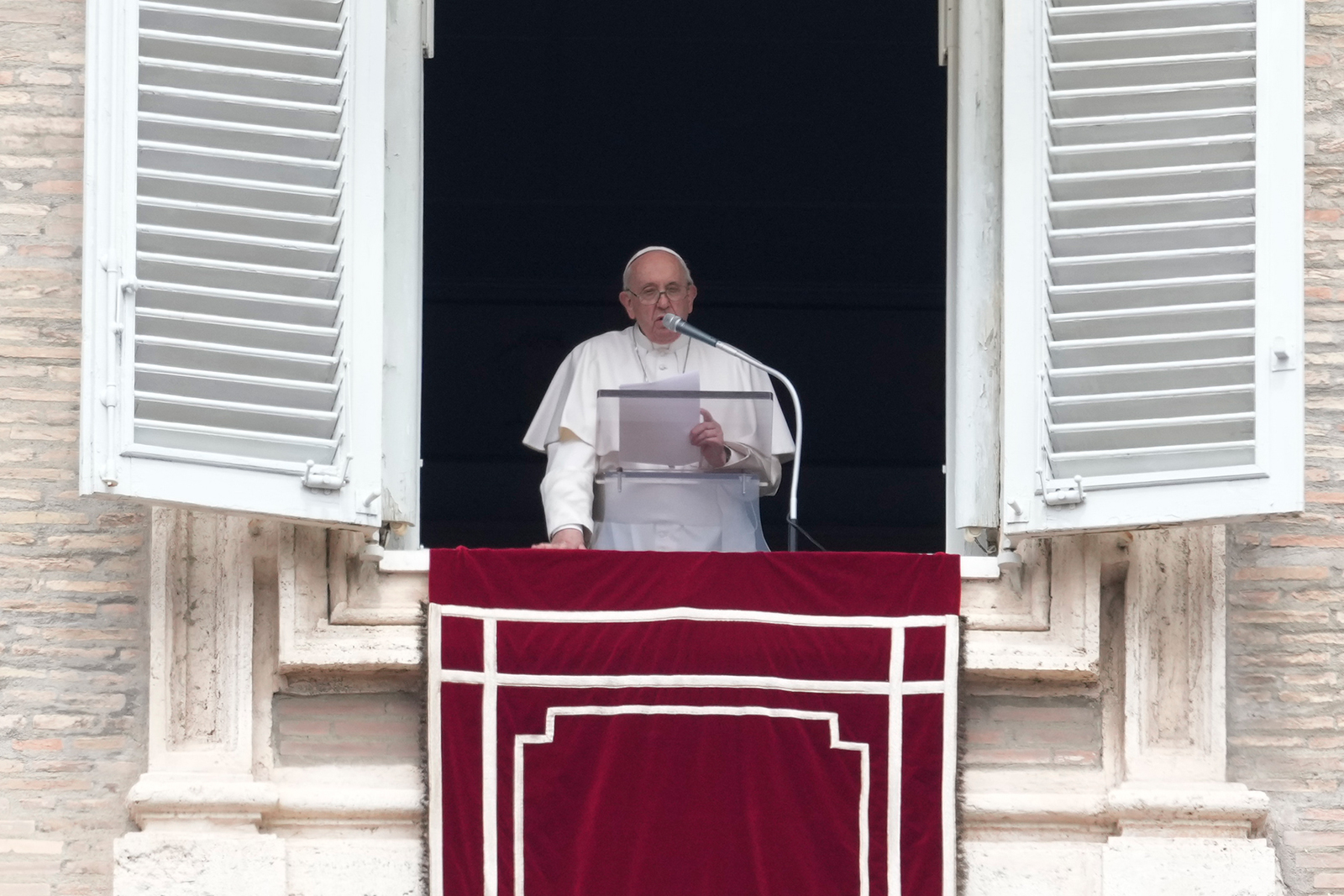 Pope Francis delivers his message from his studio window overlooking St. Peter's Square during the Regina Coeli prayer at the Vatican, on Sunday, May 1.