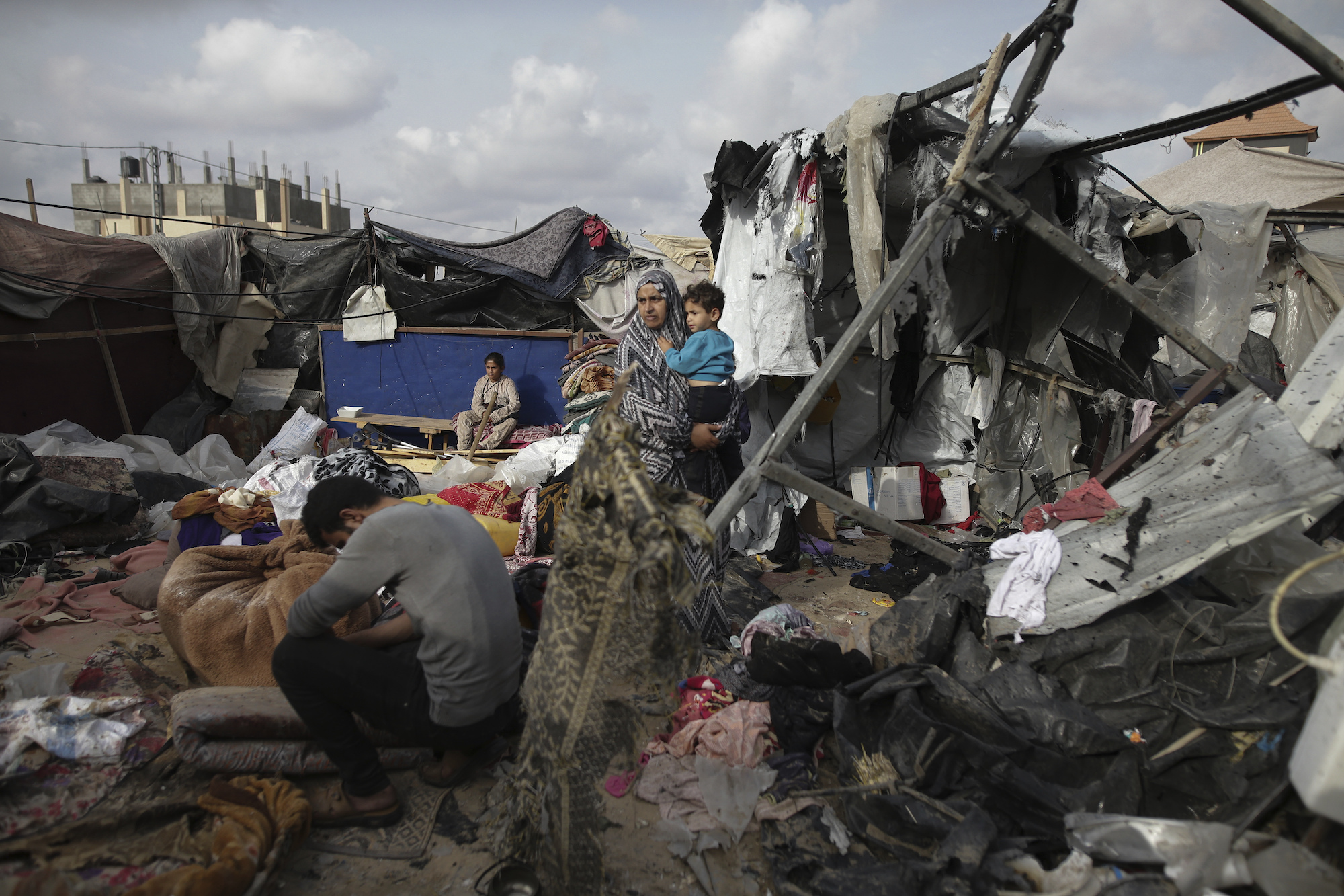 Displaced Palestinians inspect their tents destroyed by an Israeli airstrike in Rafah on Tuesday.