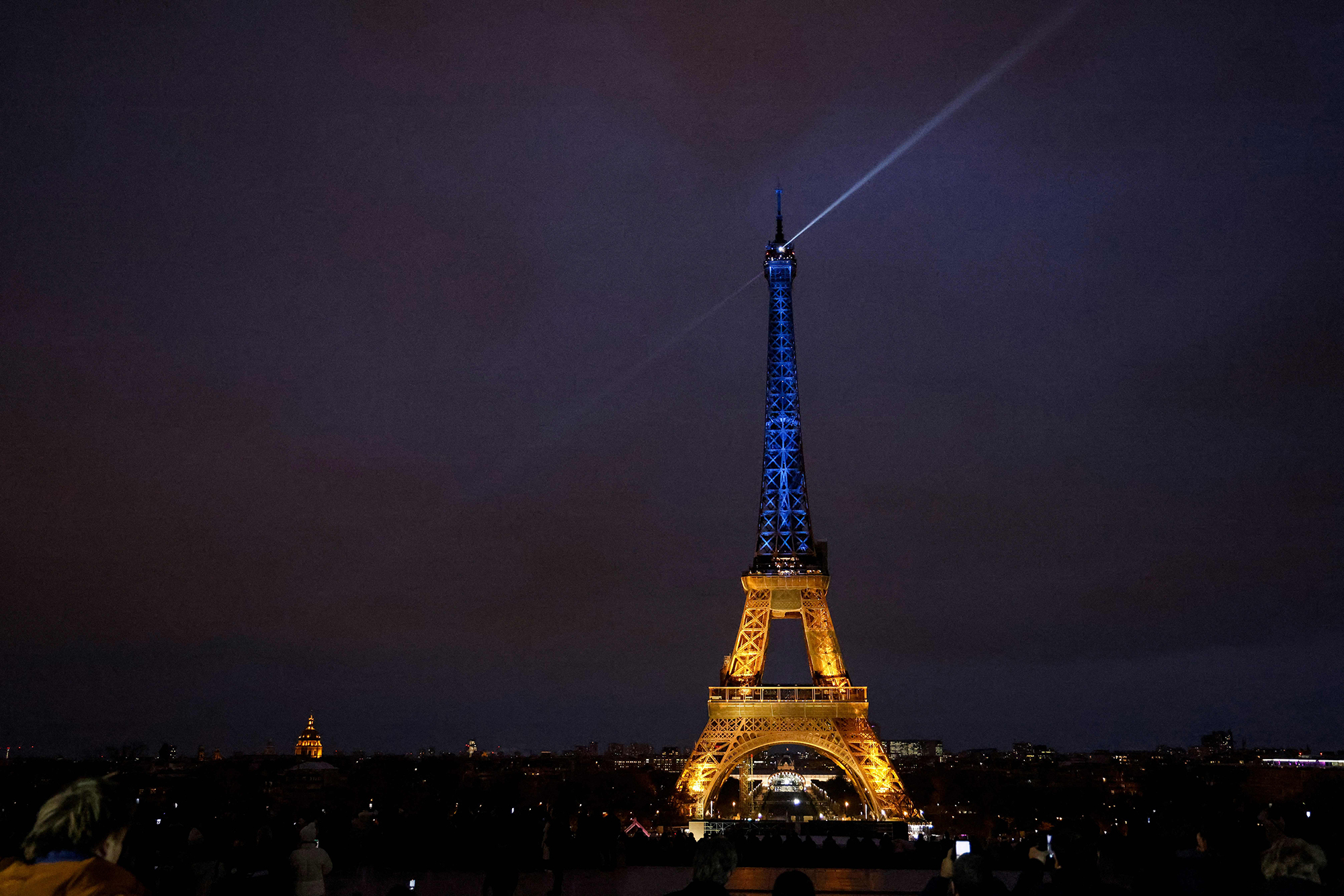 A photo shows the Eiffel Tower lit in the colors of the Ukrainnian flag in a show of support to Ukraine, one year after Russia launched a military invasion on the country, in Paris, on February 23.