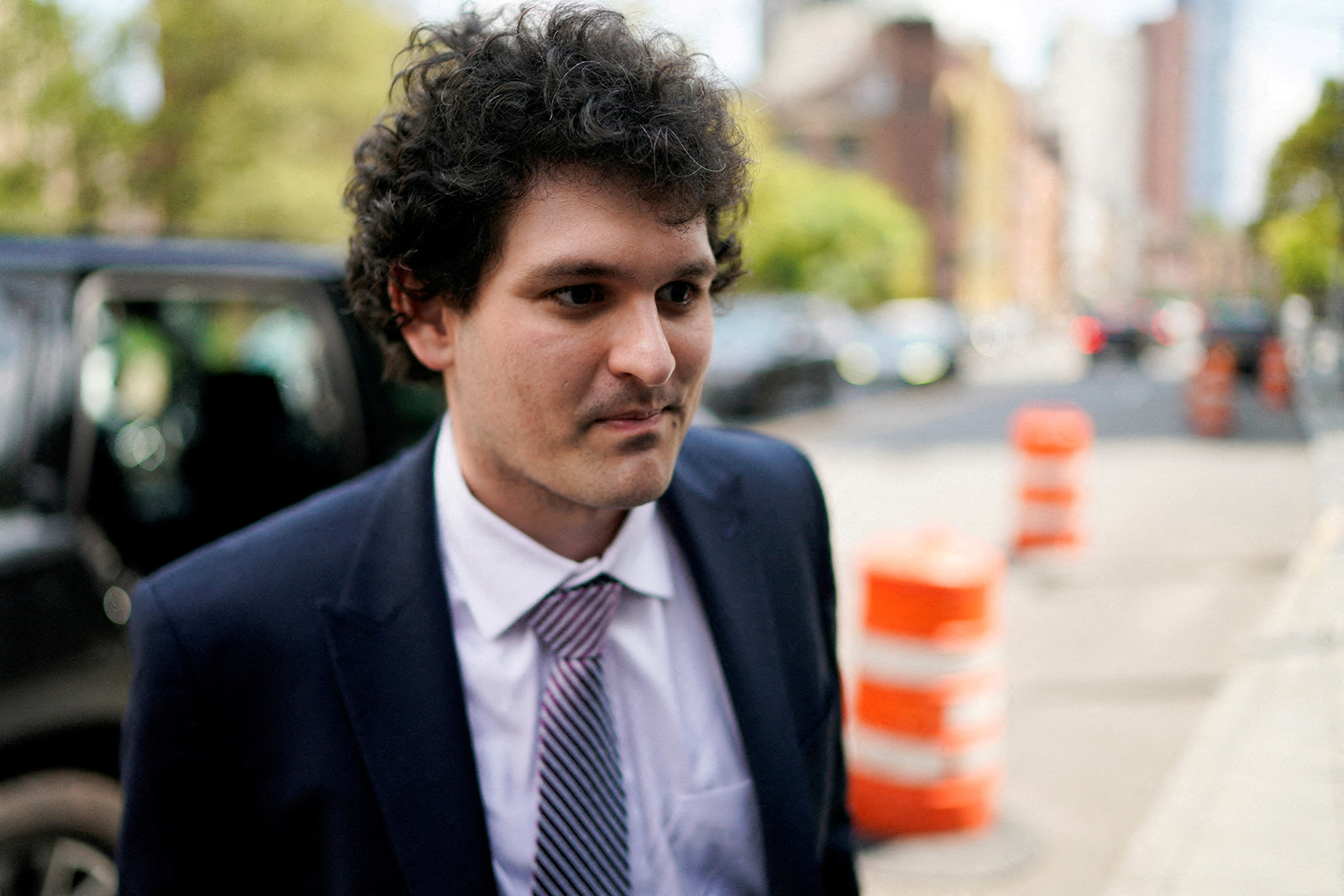 Sam Bankman-Fried seen on August 11 arriving at a courthouse in New York as lawyers pushed to persuade the judge overseeing his fraud case not to jail him ahead of trial. 