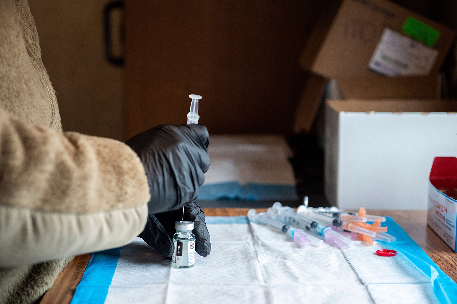 A soldier fills syringes with the Moderna Covid-19 vaccine inside a trailer at a vaccination center in Londonderry, New Hampshire on February 4.