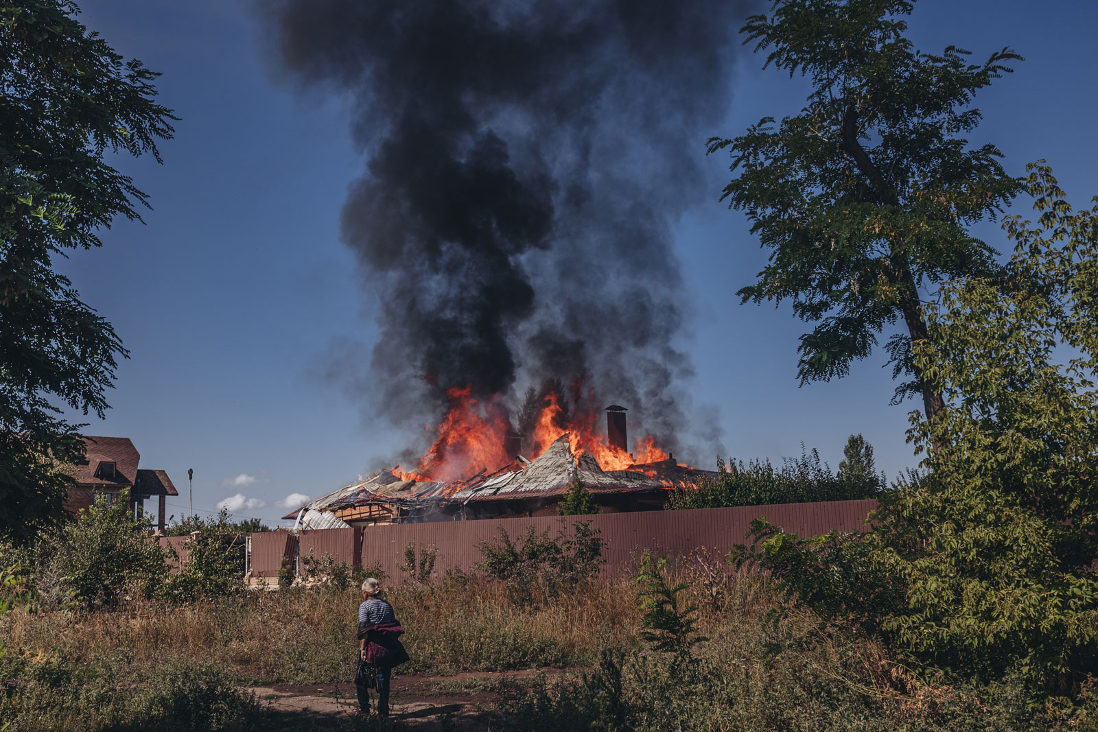 A house burns after a Russian bombing in Bakhmut on Wednesday.