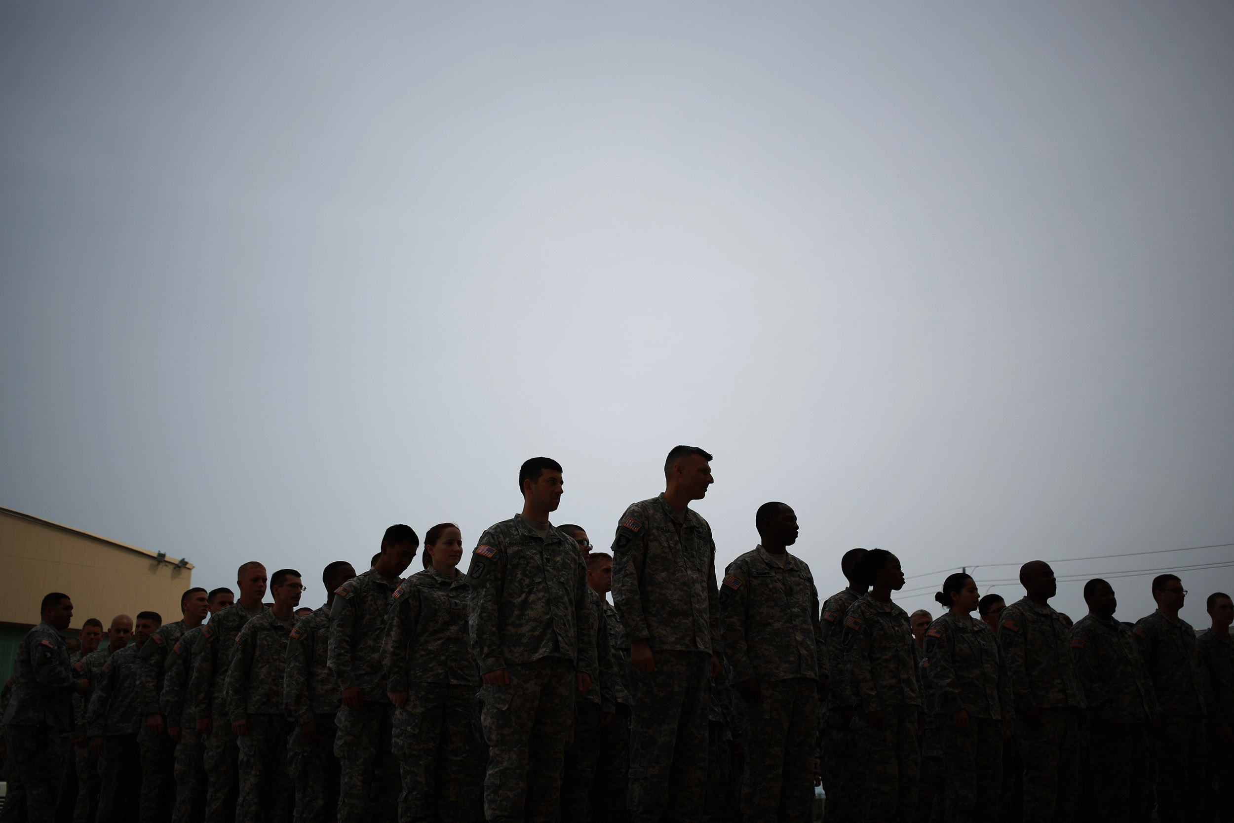 Soldiers from the U.S. Army's 101st Airborne Division stand in formation before marching in a homecoming ceremony at Fort Campbell, Kentucky, on March 21, 2015. 