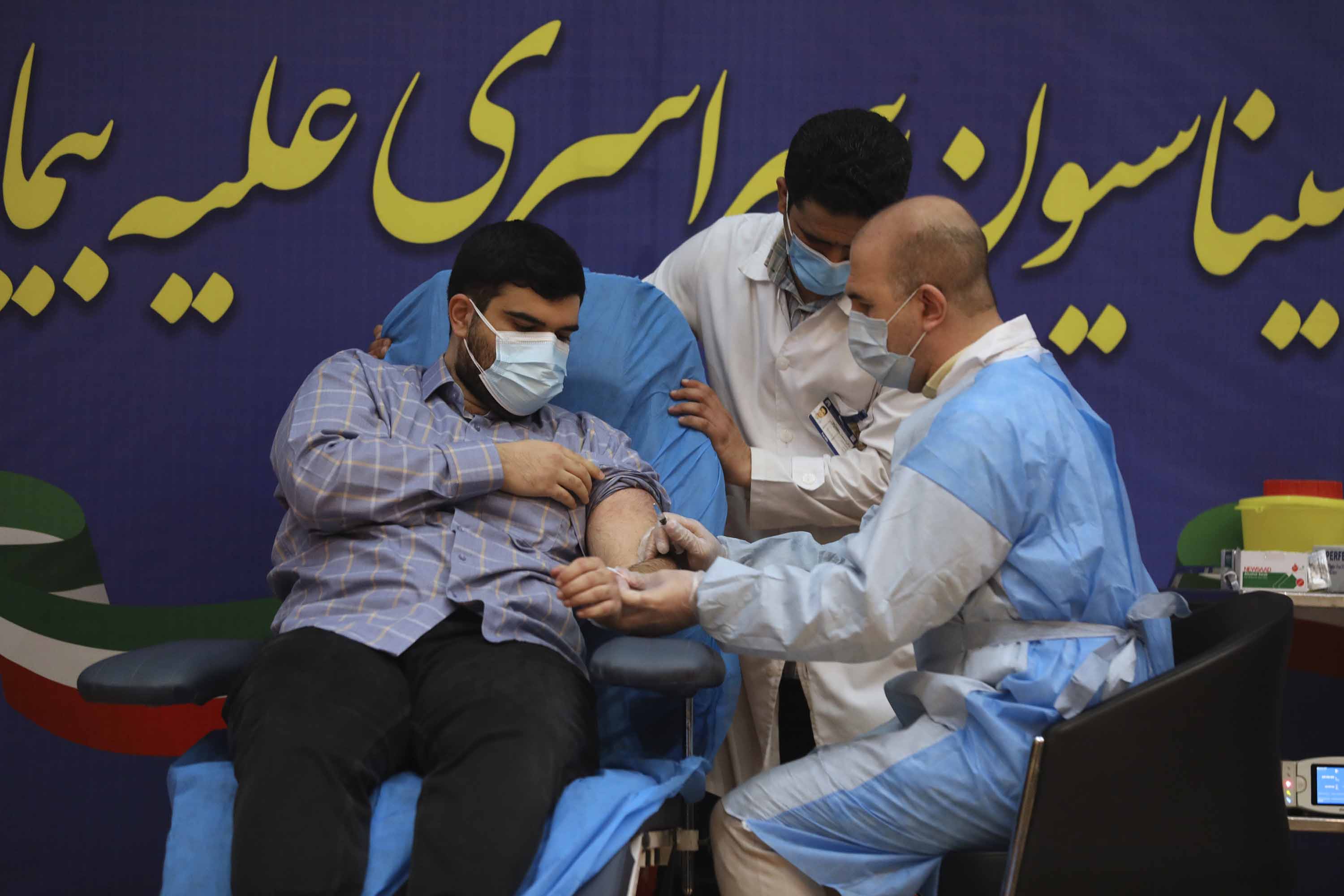 Parsa Namaki, son of Iran's Health Minister Saeed Namaki, receives a Russian Sputnik V coronavirus vaccine at Imam Khomeini Hospital in Tehran, Iran, on Tuesday, February 9.