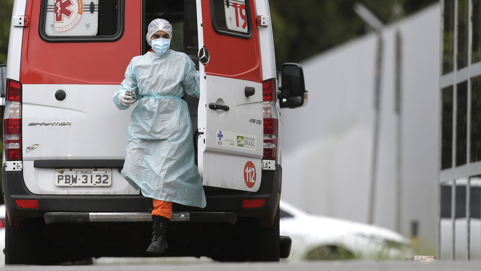A healthcare worker arrives in an ambulance bringing a patient suspected of having Covid-19 to the public HRAN Hospital in Brasilia, Brazil, on Monday, March 8.