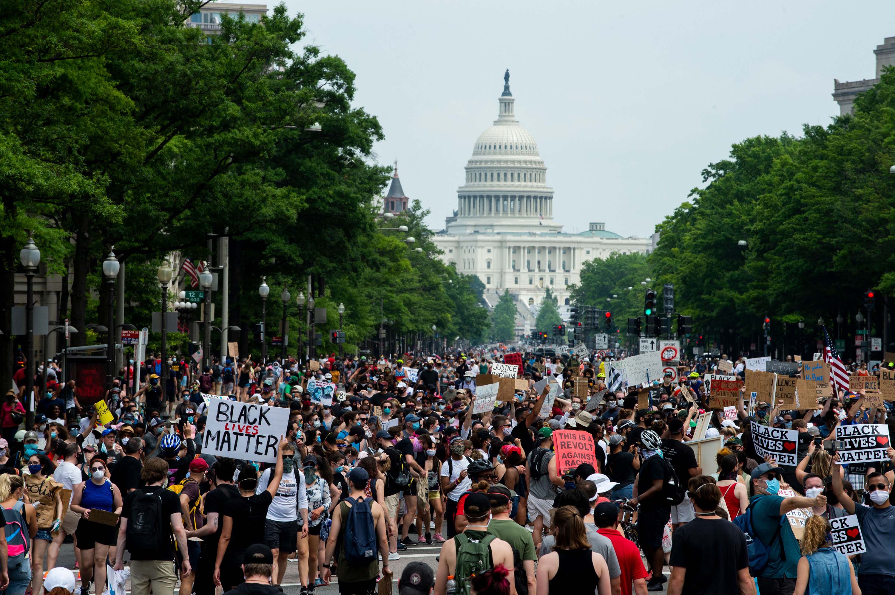 A crowd of protesters walk from the Capitol building to the White House during a protest against police brutality and racism, on June 6, in Washington, DC.