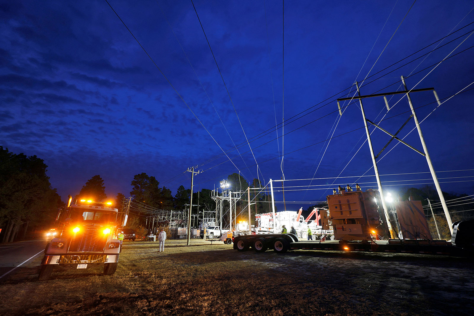 Duke Energy personnel work to restore power at a crippled electrical substation in Carthage, North Carolina, on December 4.
