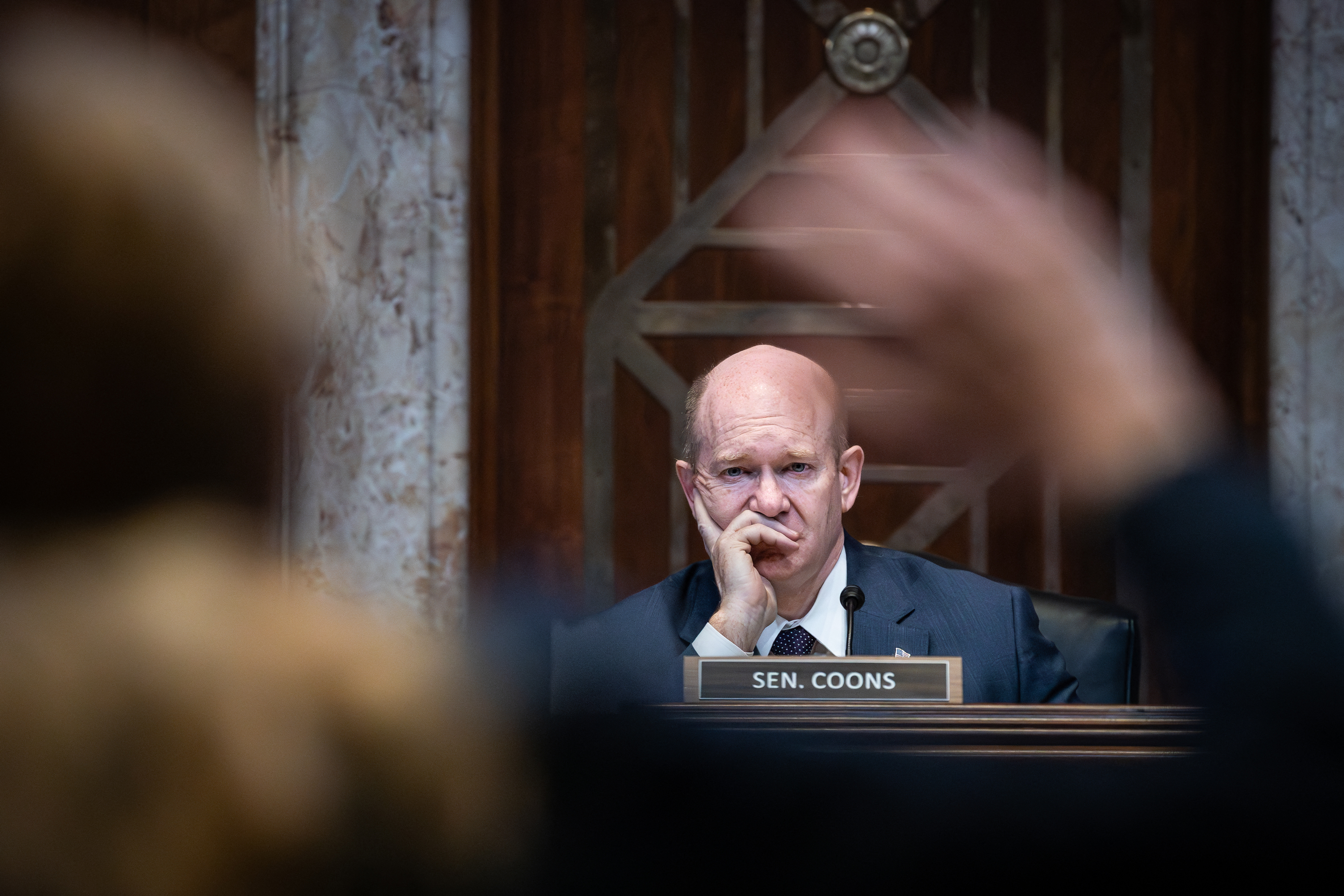 Sen. Chris Coons listens at a Senate Appropriations Committee Hearing in Washington, DC, on April 9.