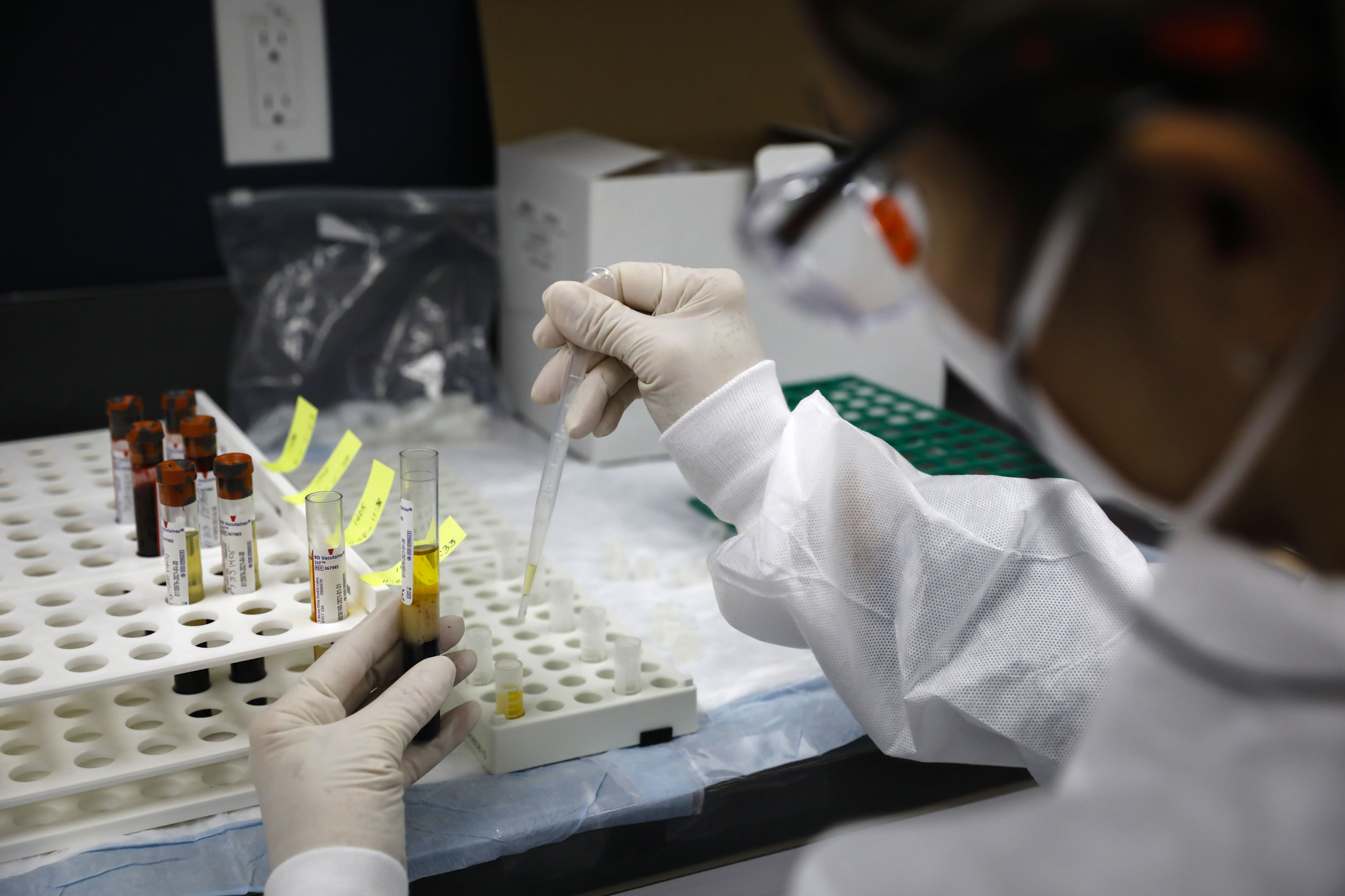 A health worker is pictured in a lab during clinical trials for a Pfizer coronavirus vaccine in Hollywood, Florida, on September 9.