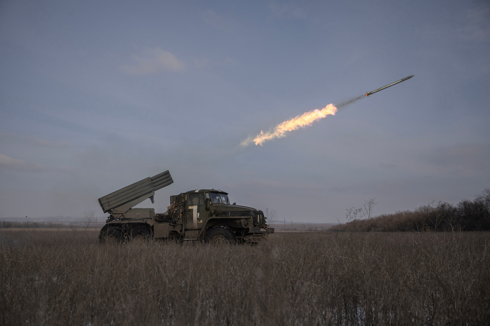 Ukrainian servicemen fire a rocket towards Russian positions on a frontline near the town of Marinka, Donestsk Oblast, on Tuesday.