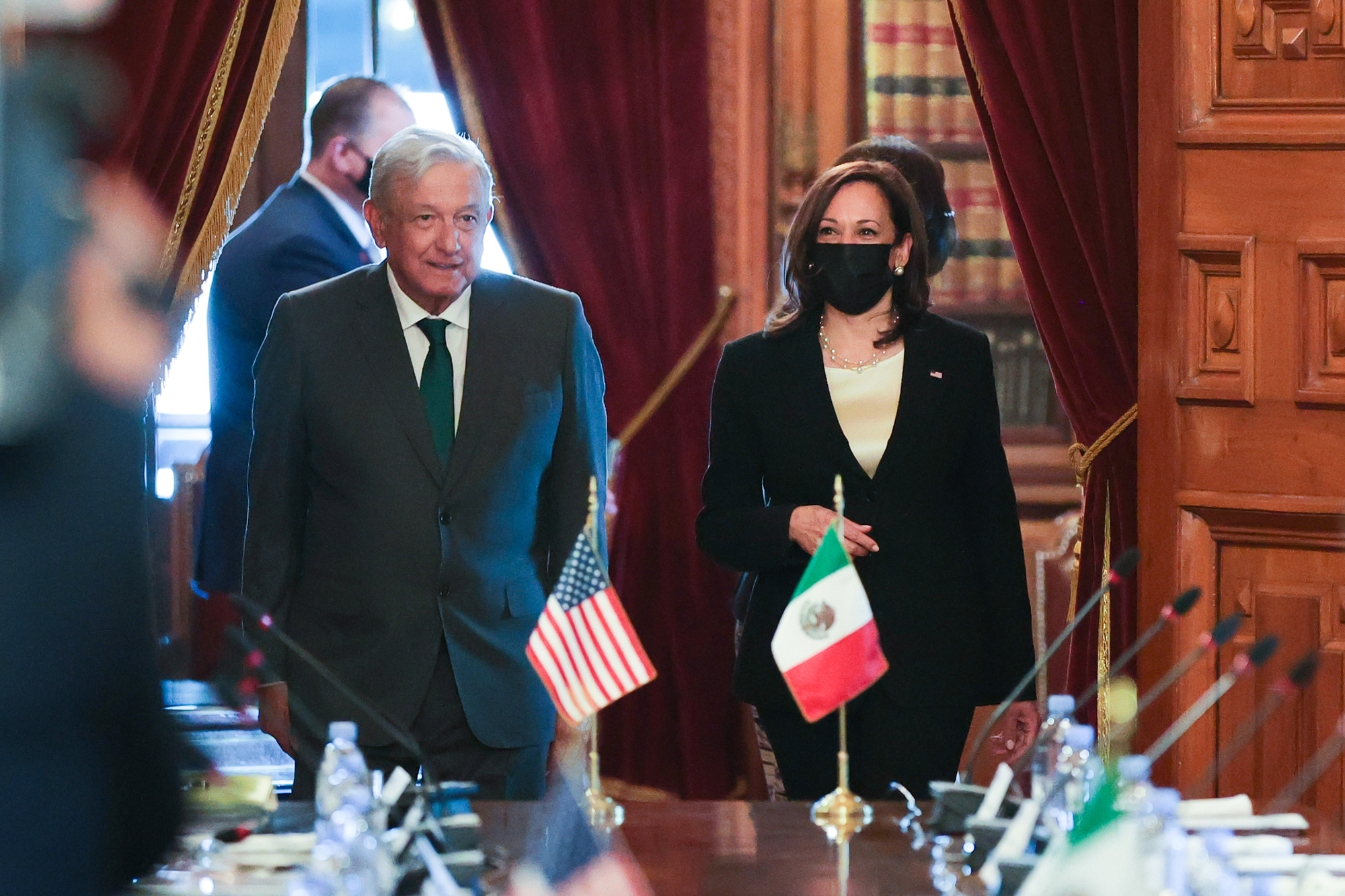 Vice President Kamala Harris, right, and Mexican President Andres Manuel Lopez Obrador arrive during a private meeting at Palacio Nacional on June 8 in Mexico City.