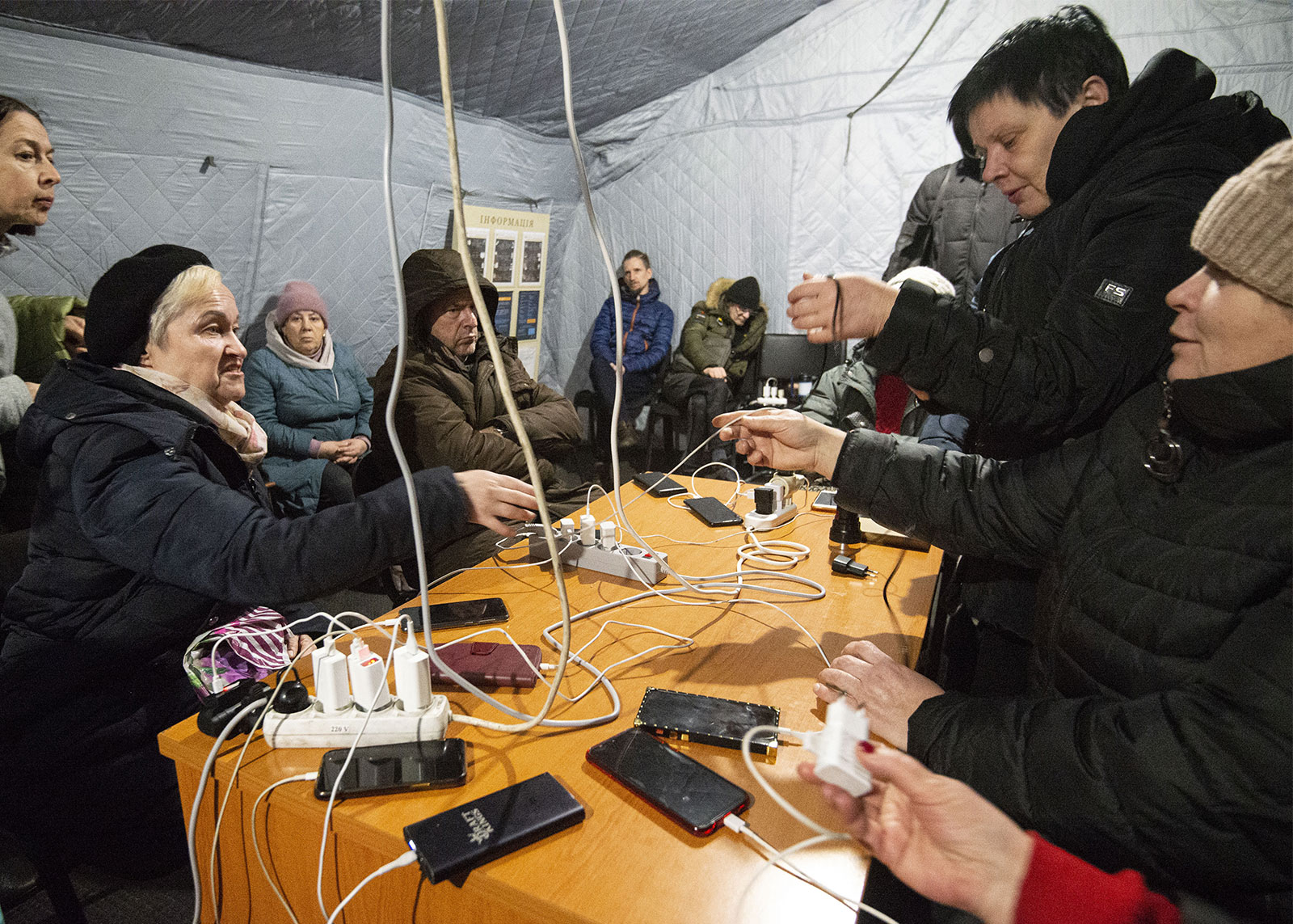 Residents in Kyiv charge their mobile phones at a "Points of Invincibility" center on December 17. 