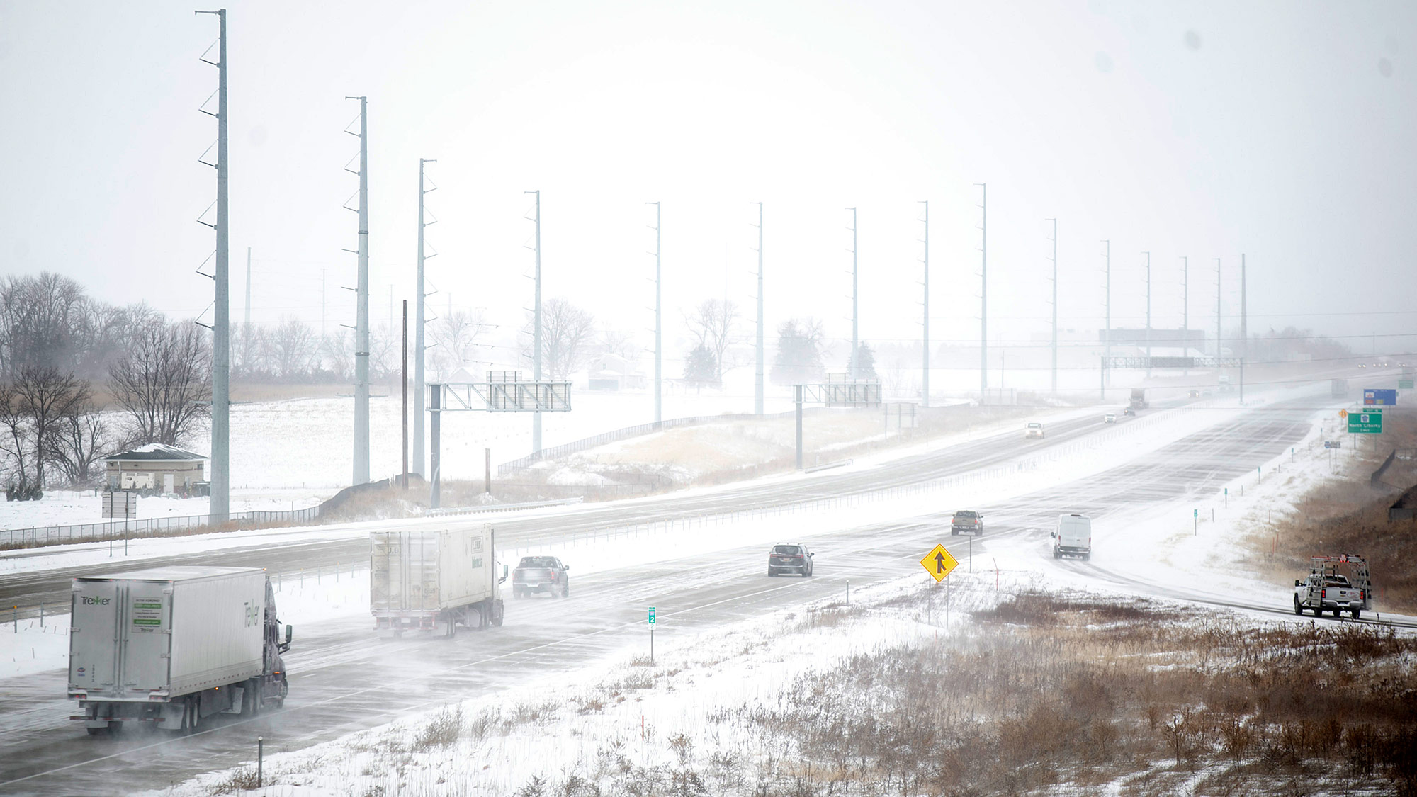 Motorists drive through snow in North Liberty, Iowa, on December 22. 