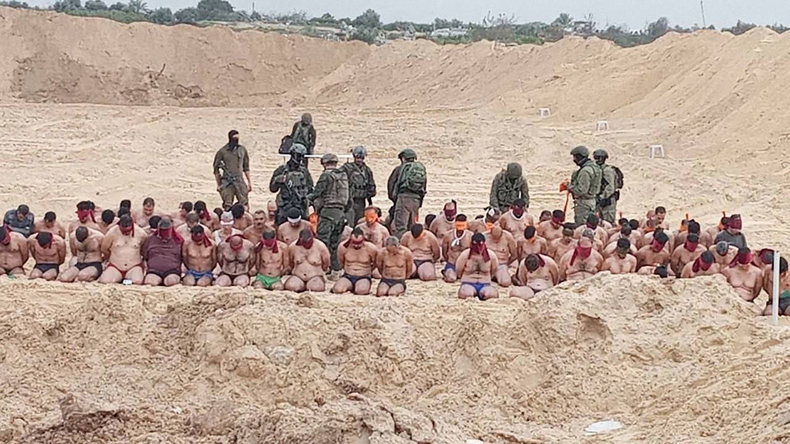 Images from Gaza circulating on social media showed a mass detention by the Israeli military of men who were made to strip to their underwear, kneel on the street, wear blindfolds and pack into the cargo bed of a military vehicle.