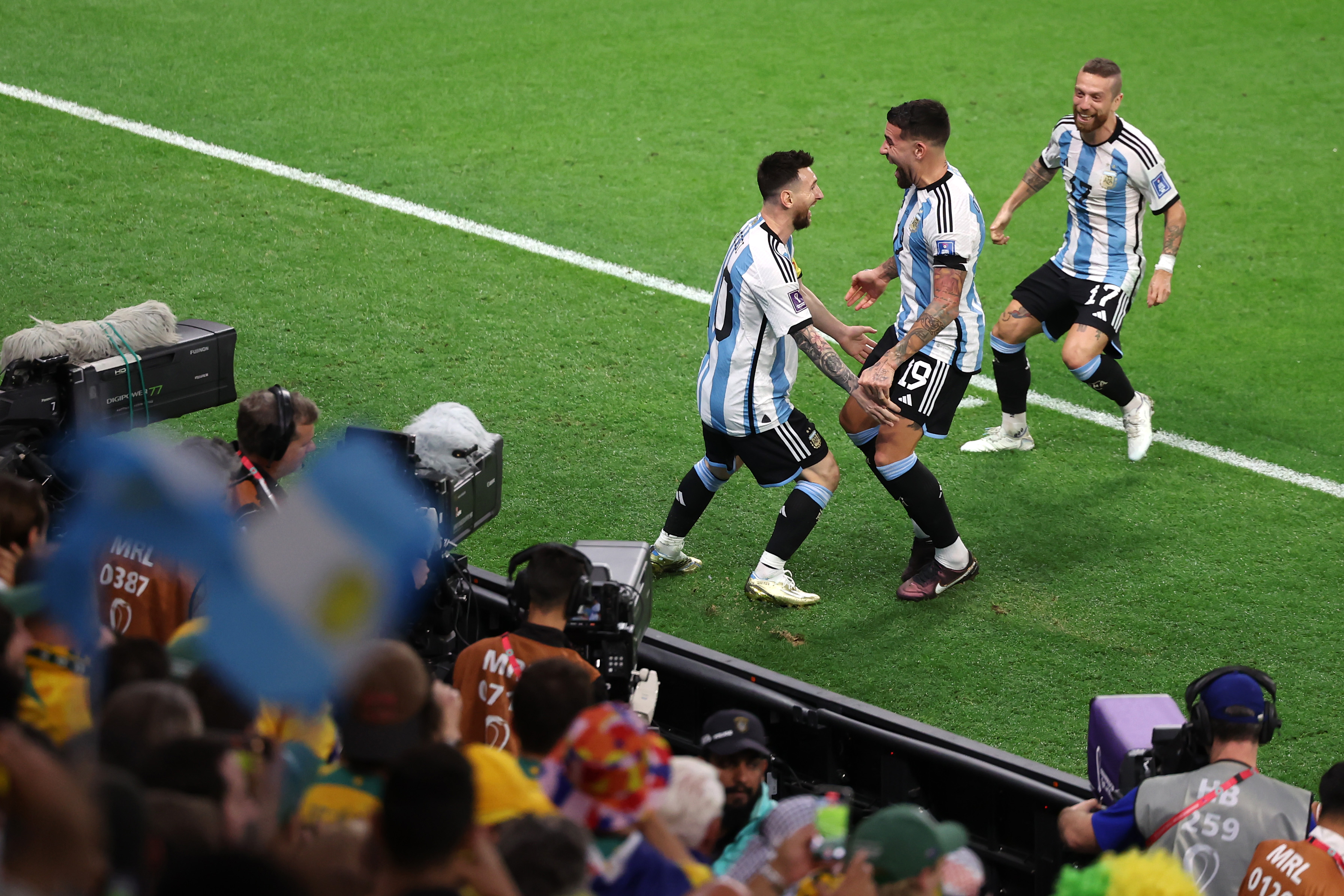 Lionel Messi of Argentina celebrates with teammates after scoring the team's first goal against Australia at Ahmad bin Ali Stadium in Al Rayyan, Qatar on December 3.