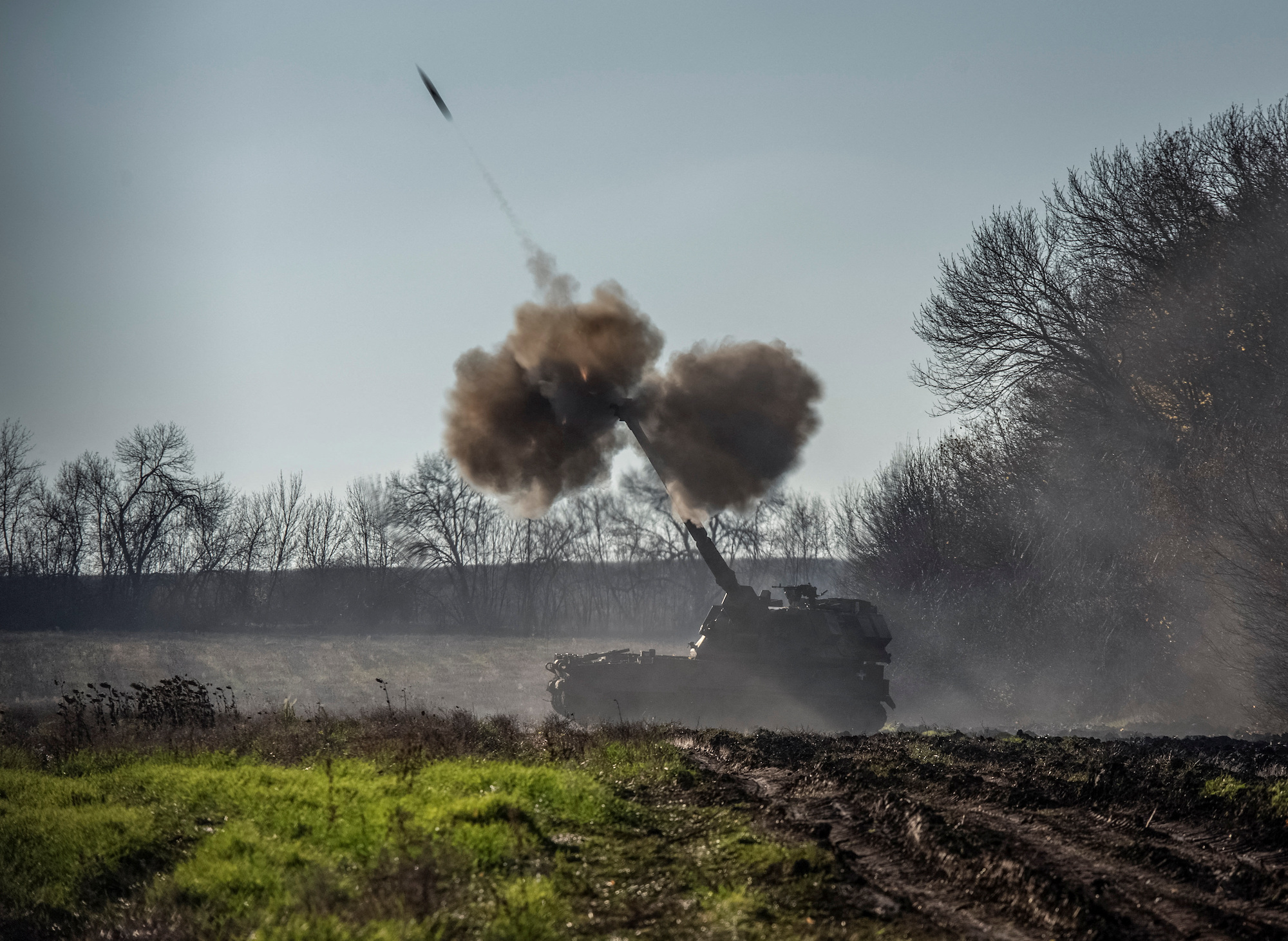 Ukrainian forces fire a howitzer round toward Russian positions in the Donetsk Oblast on Tuesday.