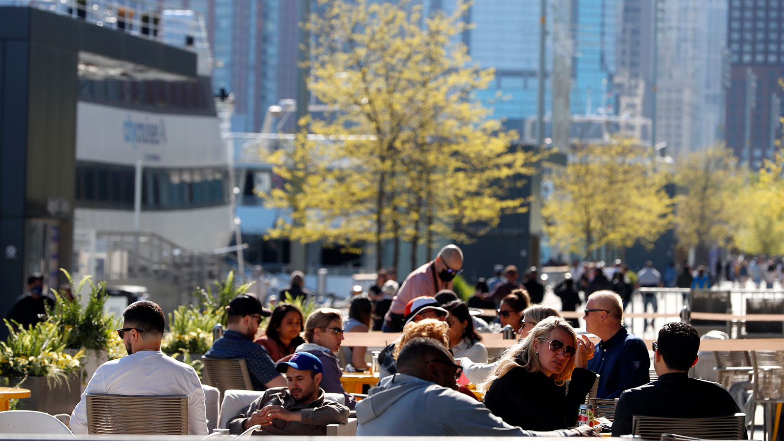 People enjoy their time in an outside sitting area of a restaurant in Chicago's Navy Pier on Friday, May 14. 