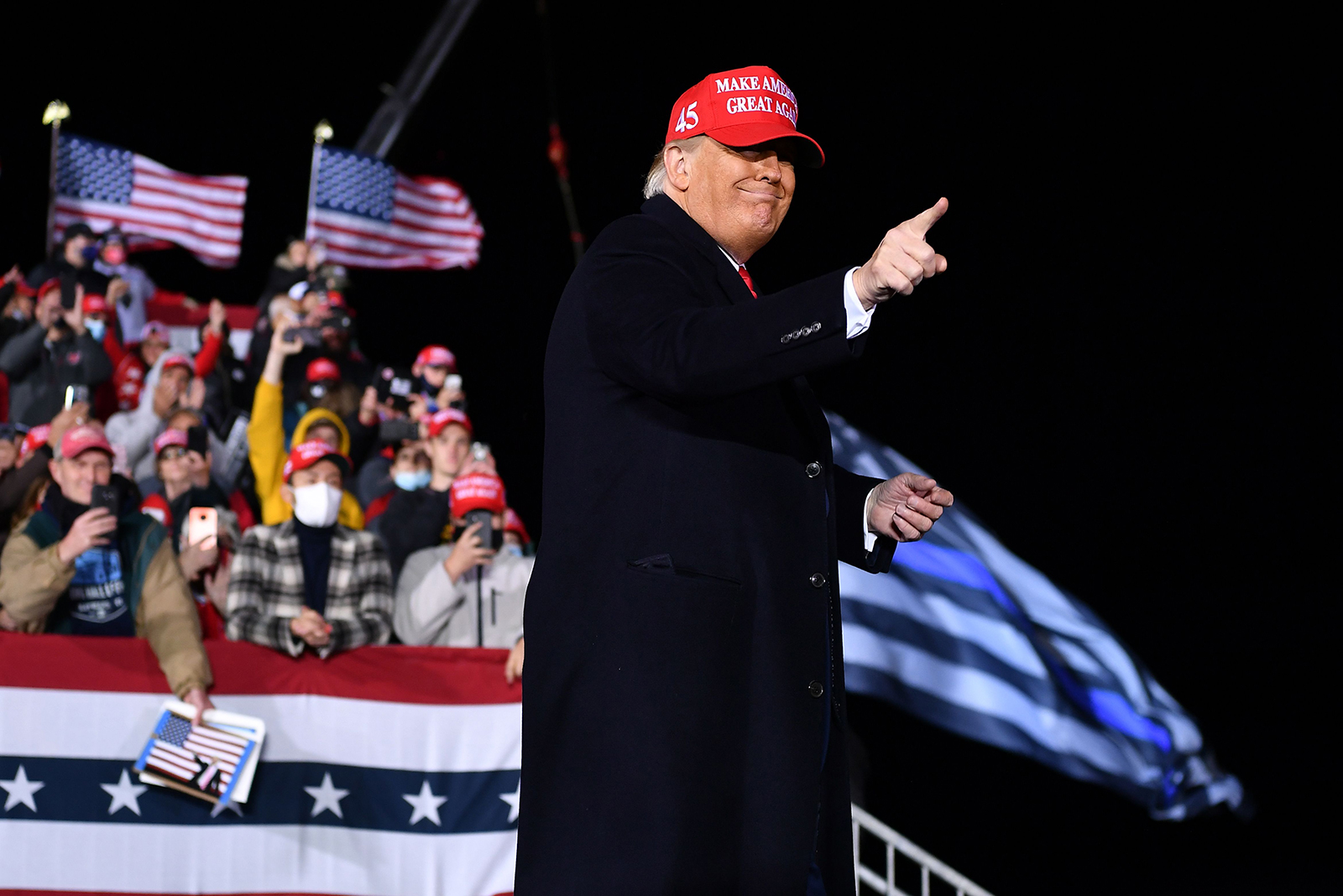 President Donald Trump gestures during a rally at Southern Wisconsin Regional Airport in Janesville, Wisconsin on October 17.