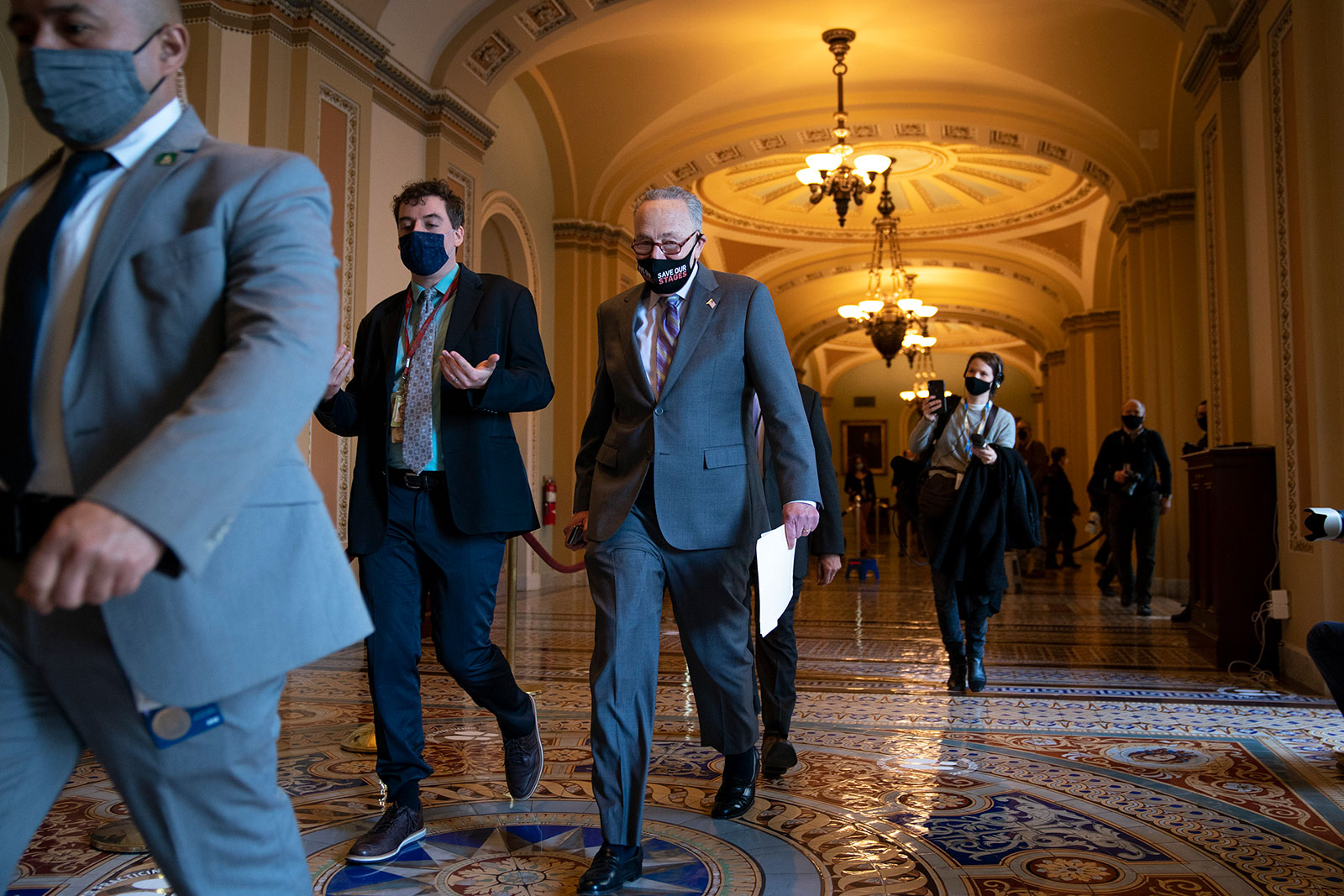 Senate Majority Leader Chuck Schumer walks through the Capitol on Tuesday.