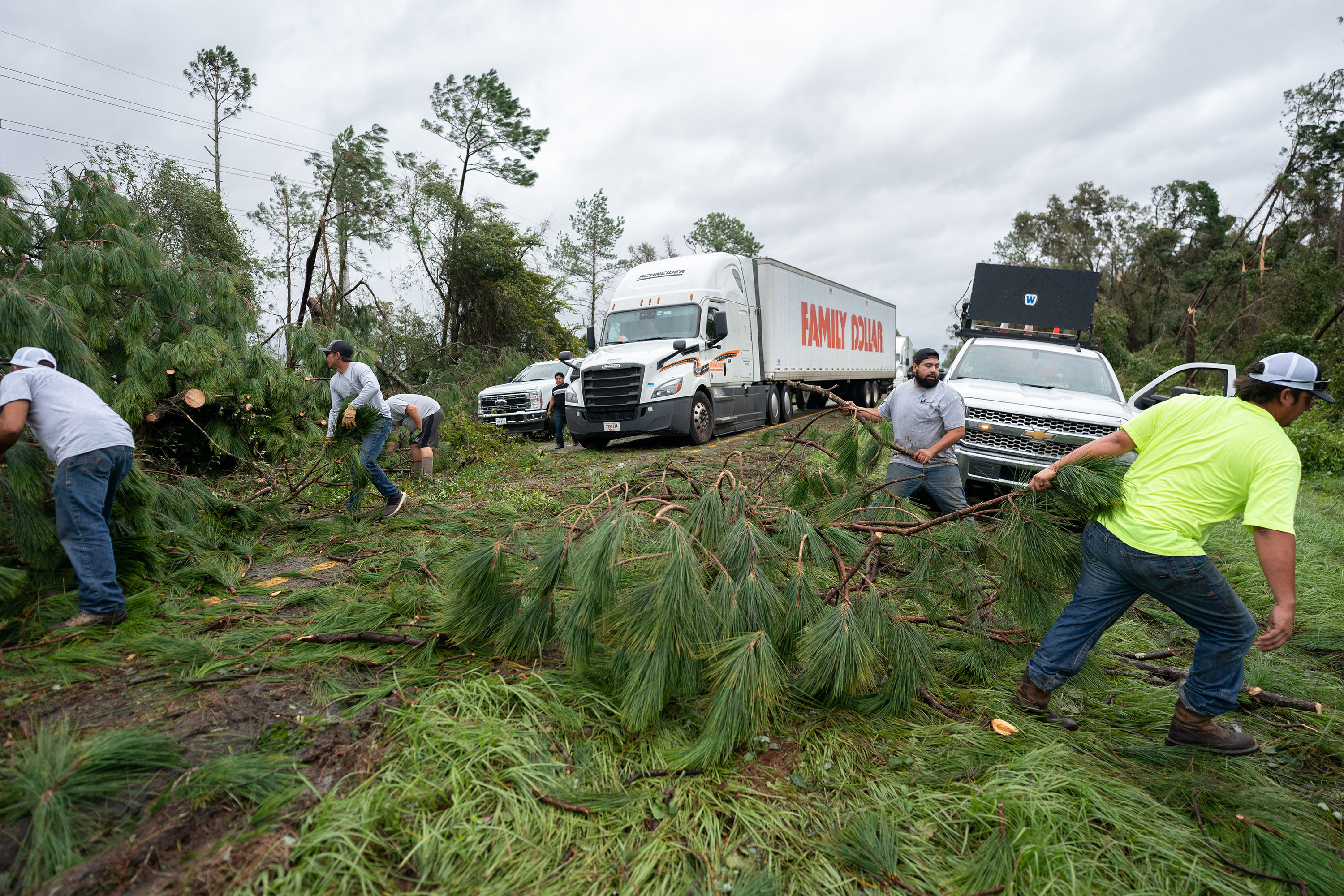 People work to clear I-10 of fallen trees near Madison, Florida, on Wednesday. 