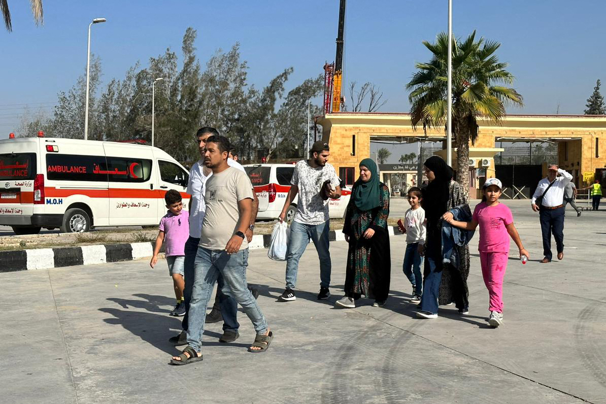 People cross into Egypt at the Rafah border crossing on November 9.
