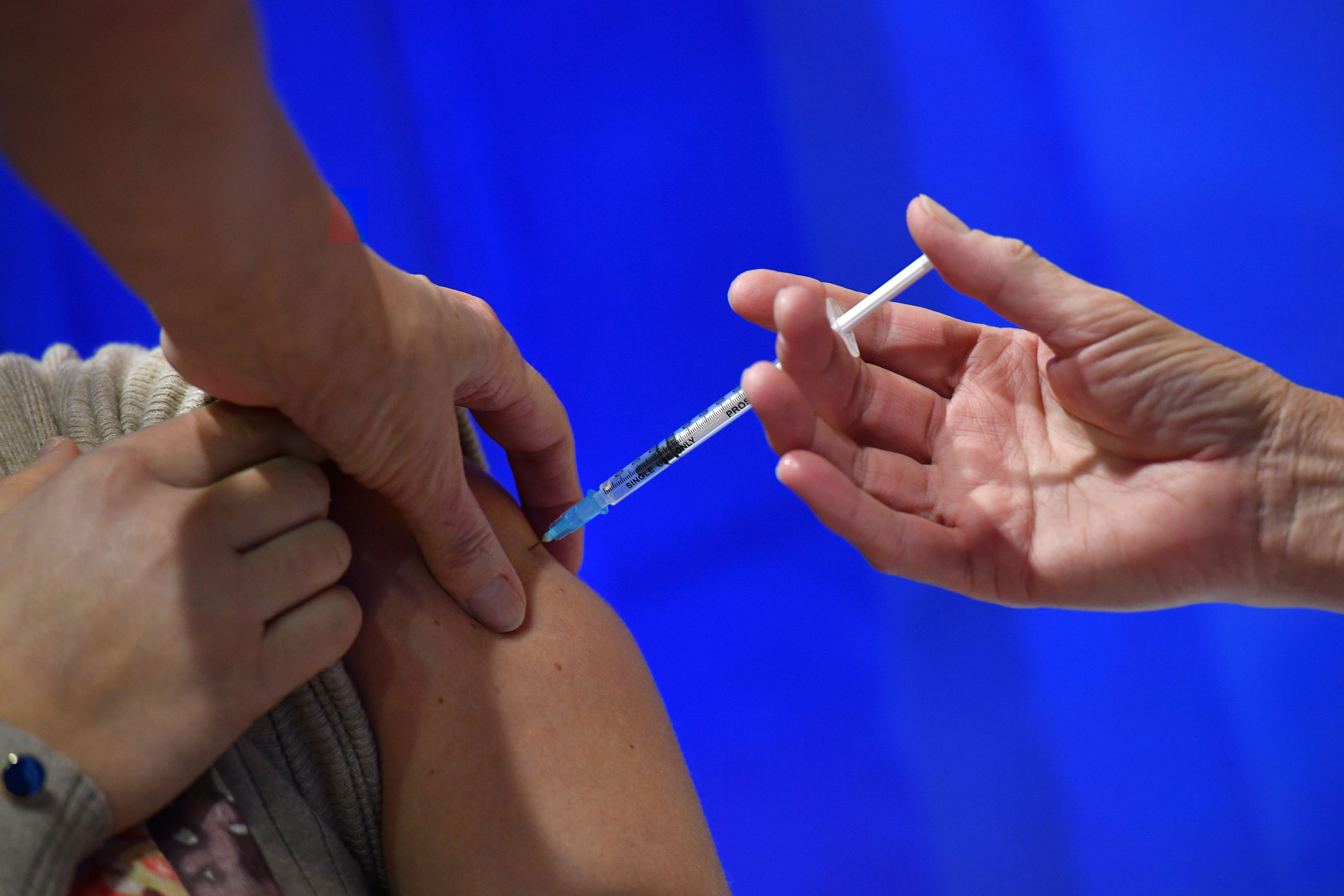 A person in Cardiff, Wales, receives an injection of the Pfizer-BioNTech Covid-19 vaccine on December 8.