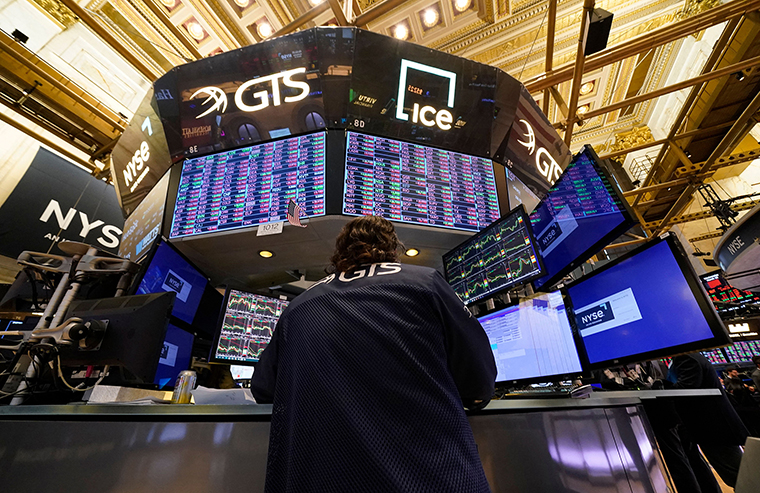 Traders work on the floor of the New York Stock Exchange on March 15.