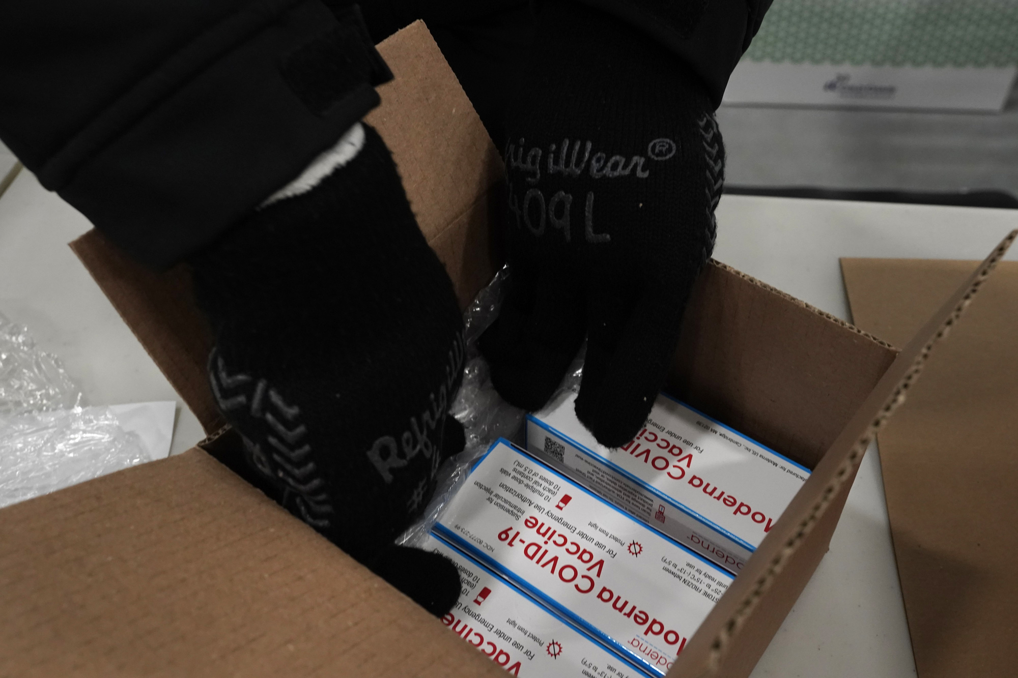 Boxes containing the Moderna Covid-19 vaccine are prepared to be shipped at the McKesson distribution center in Olive Branch, Mississippi, on December 20.