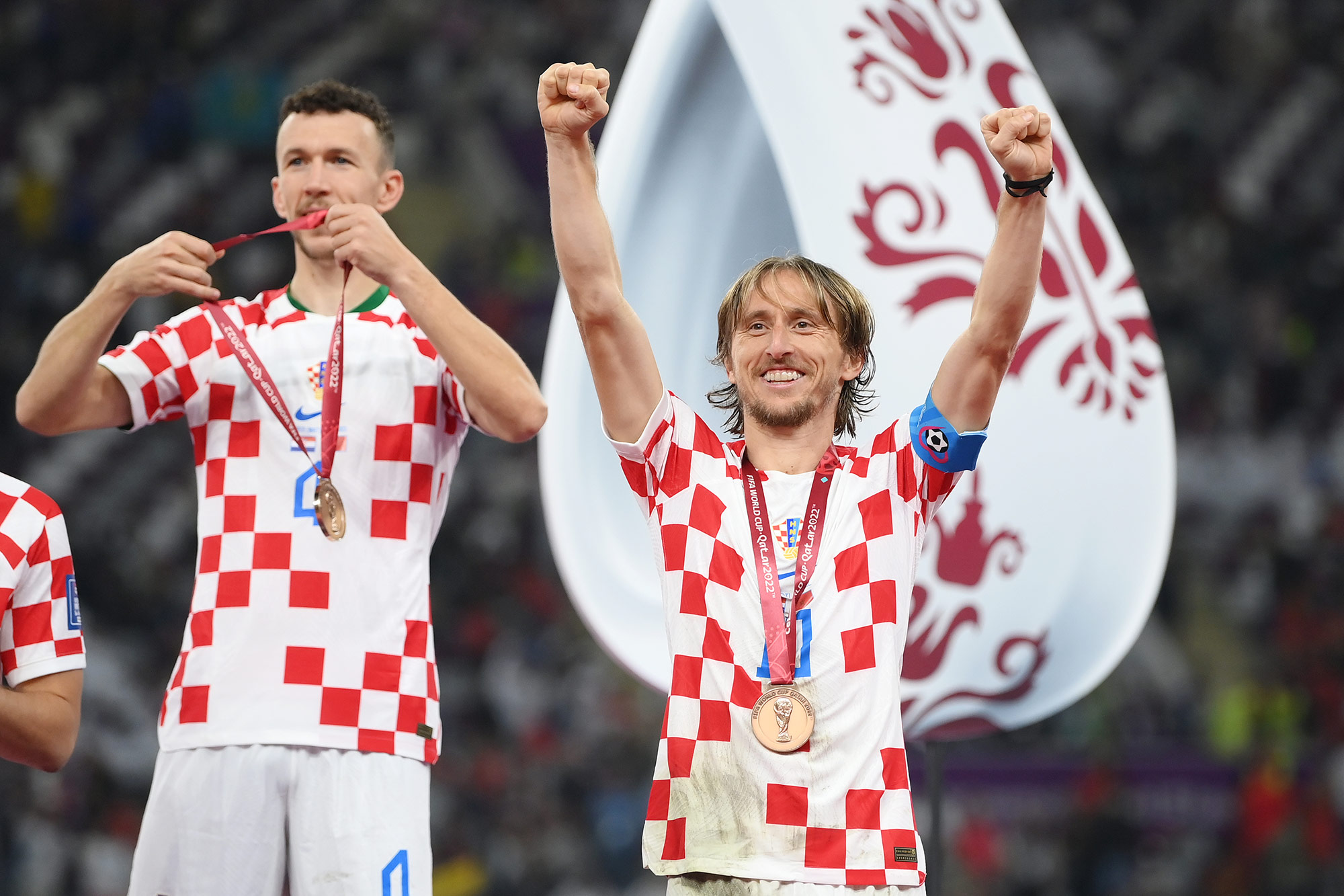 Croatia captain Luka Modrić, right, celebrates after his team’s third place win over Morocco on Saturday, December 17. 